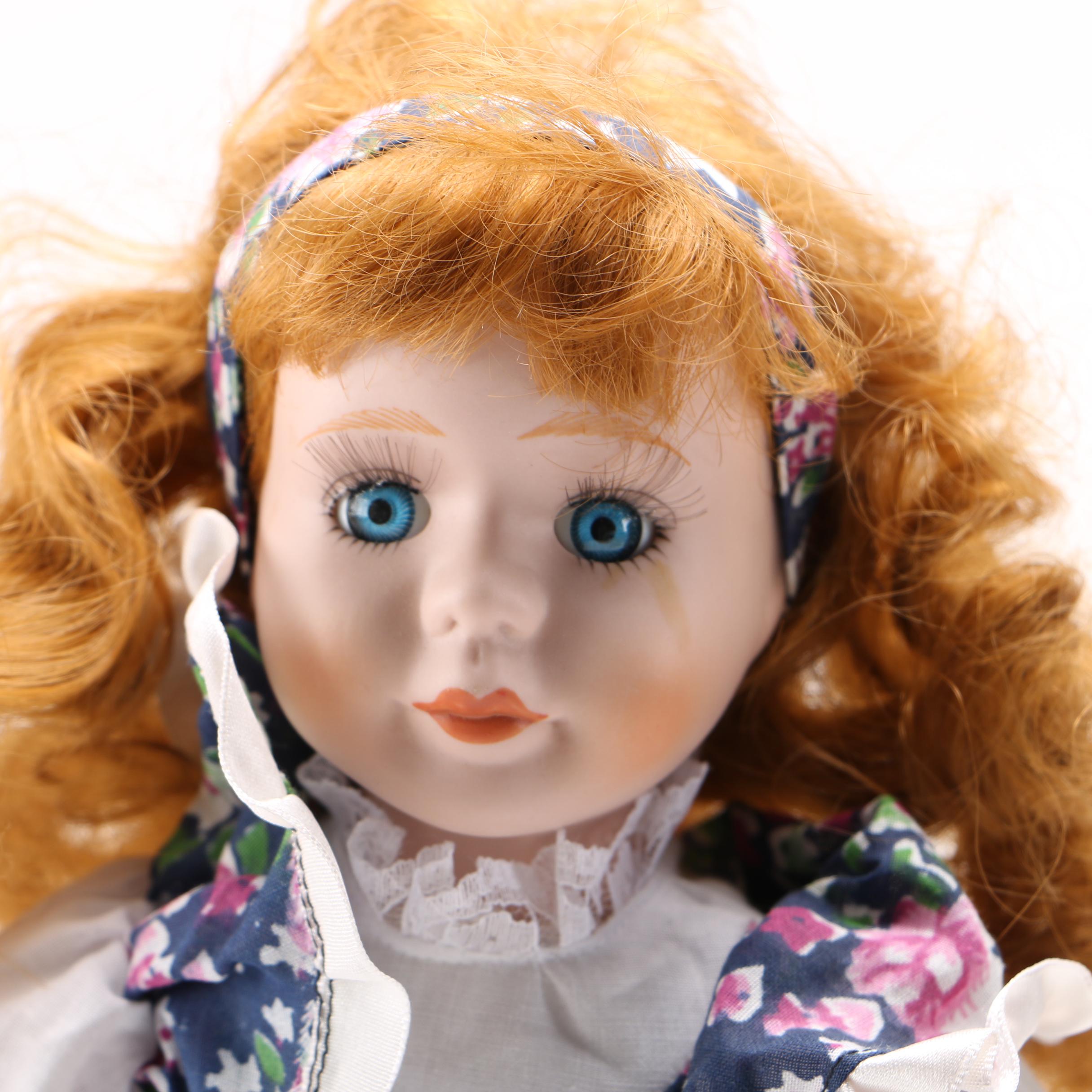 Four Porcelain Collector Dolls