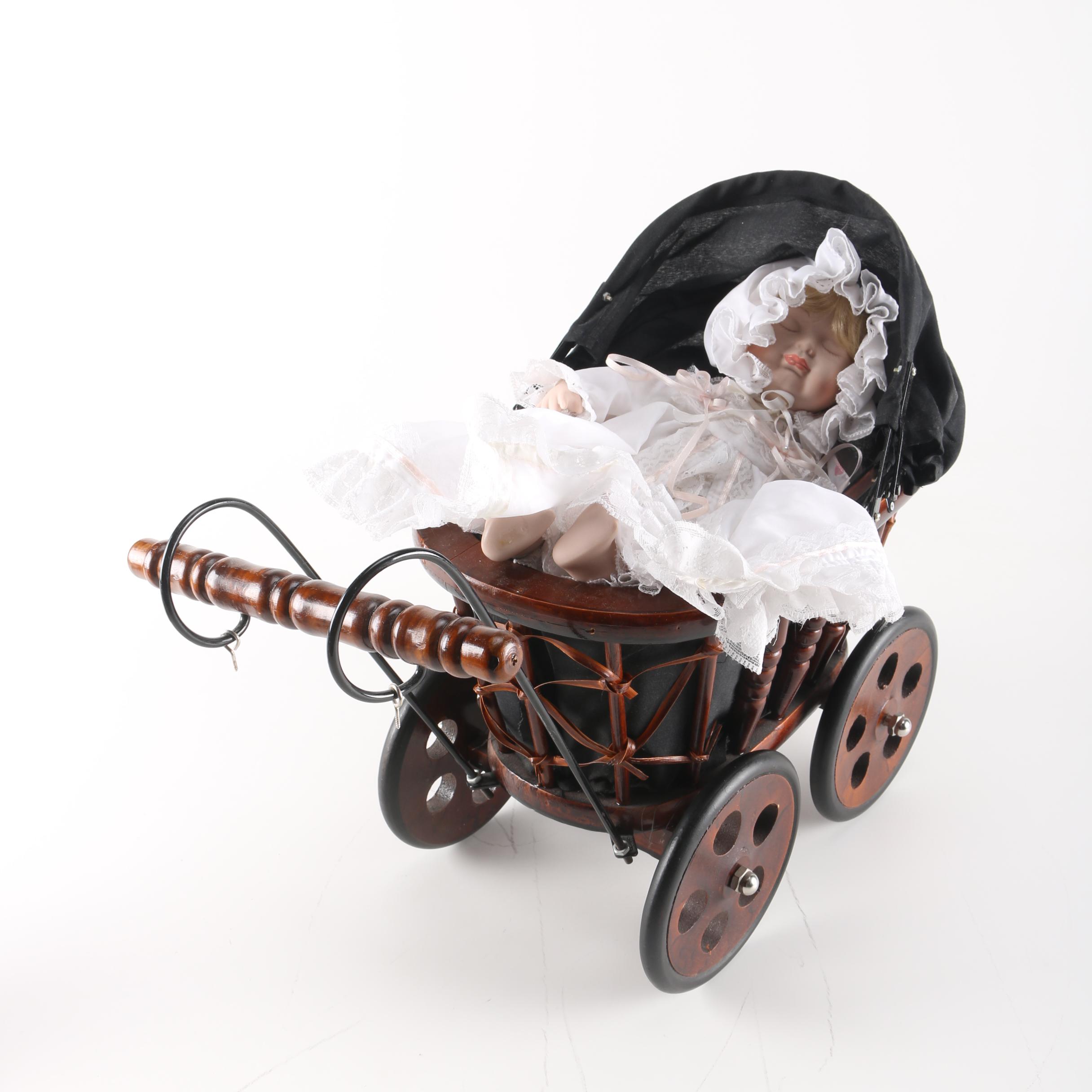Porcelain Baby Doll in Cherry Finish Doll Pram