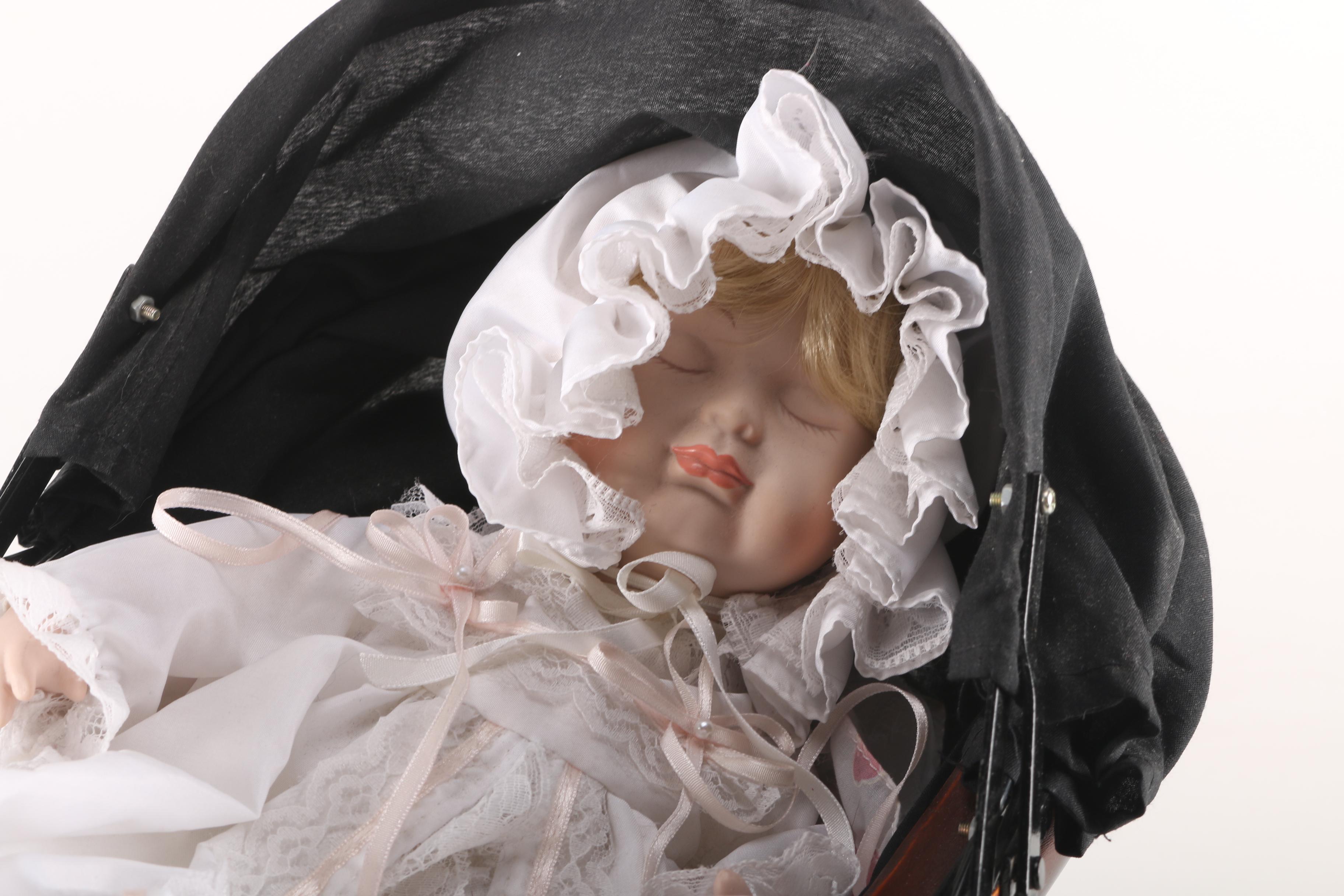 Porcelain Baby Doll in Cherry Finish Doll Pram