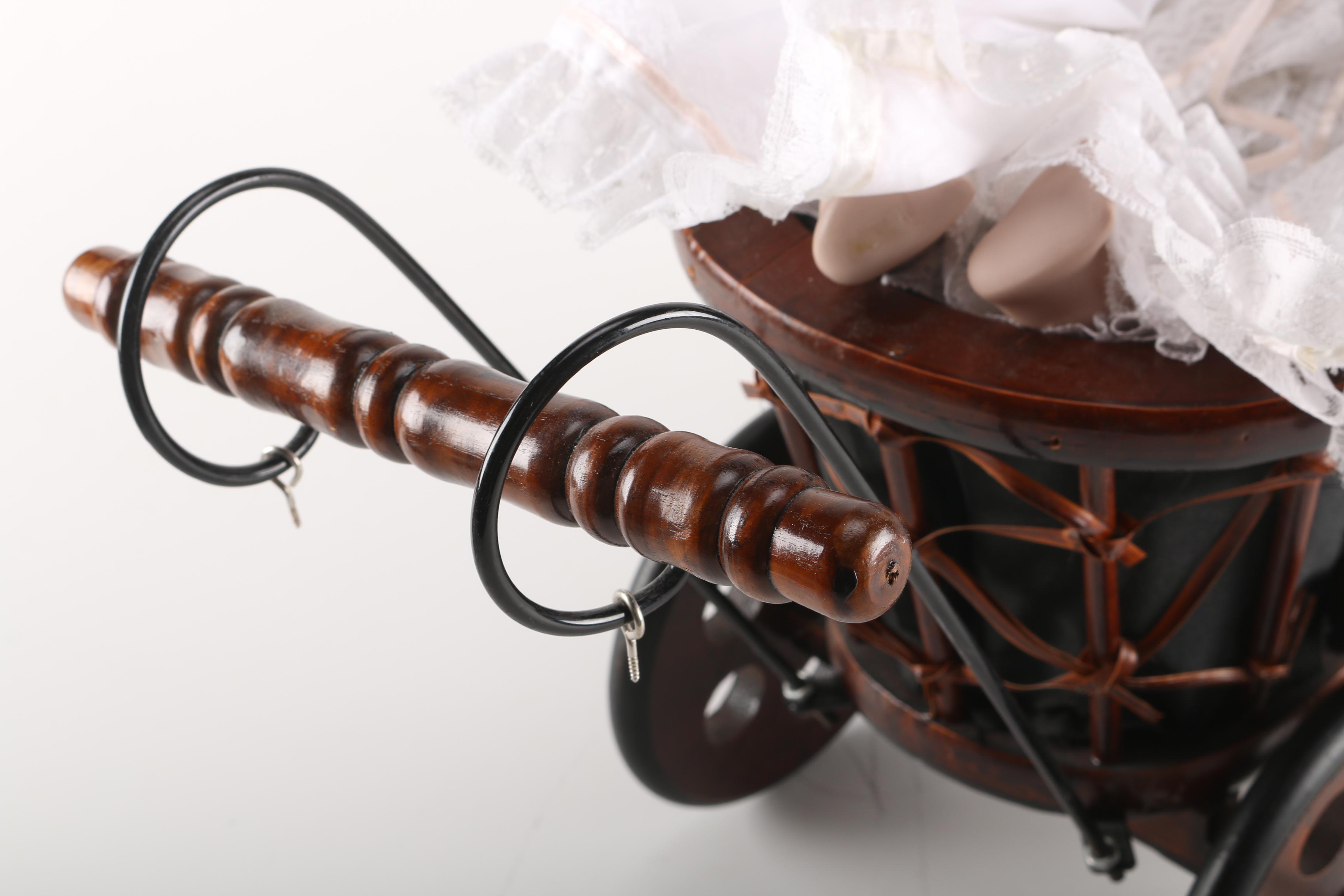 Porcelain Baby Doll in Cherry Finish Doll Pram