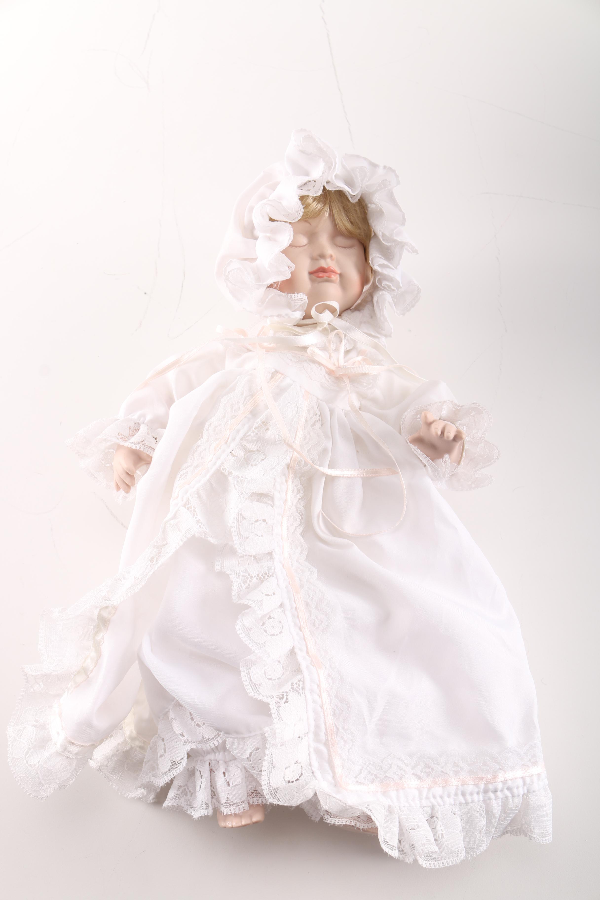 Porcelain Baby Doll in Cherry Finish Doll Pram