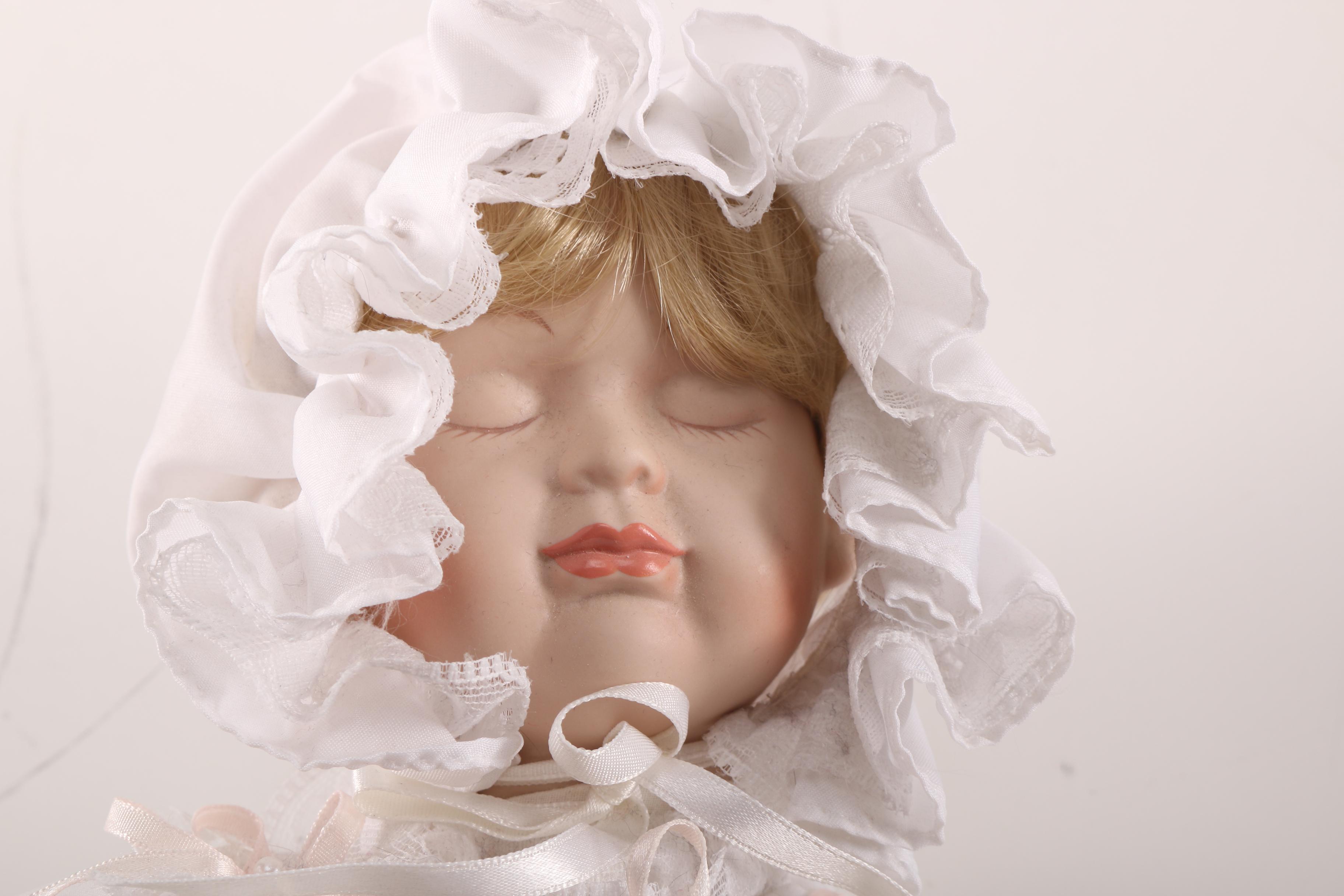 Porcelain Baby Doll in Cherry Finish Doll Pram