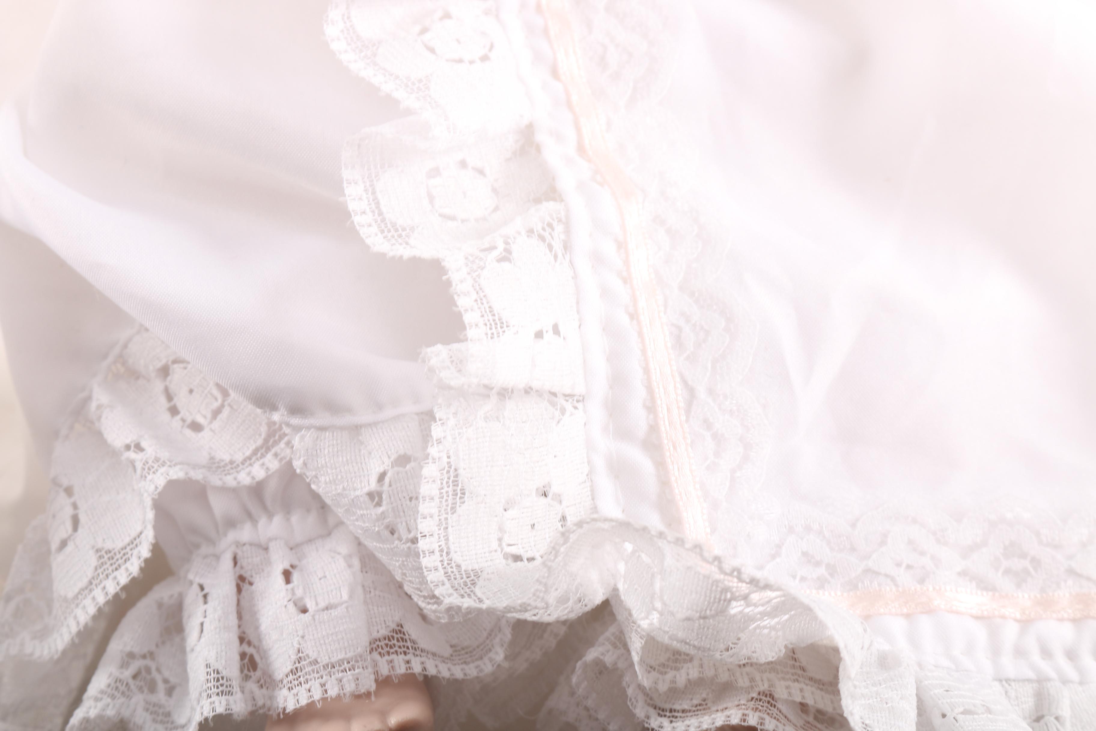 Porcelain Baby Doll in Cherry Finish Doll Pram