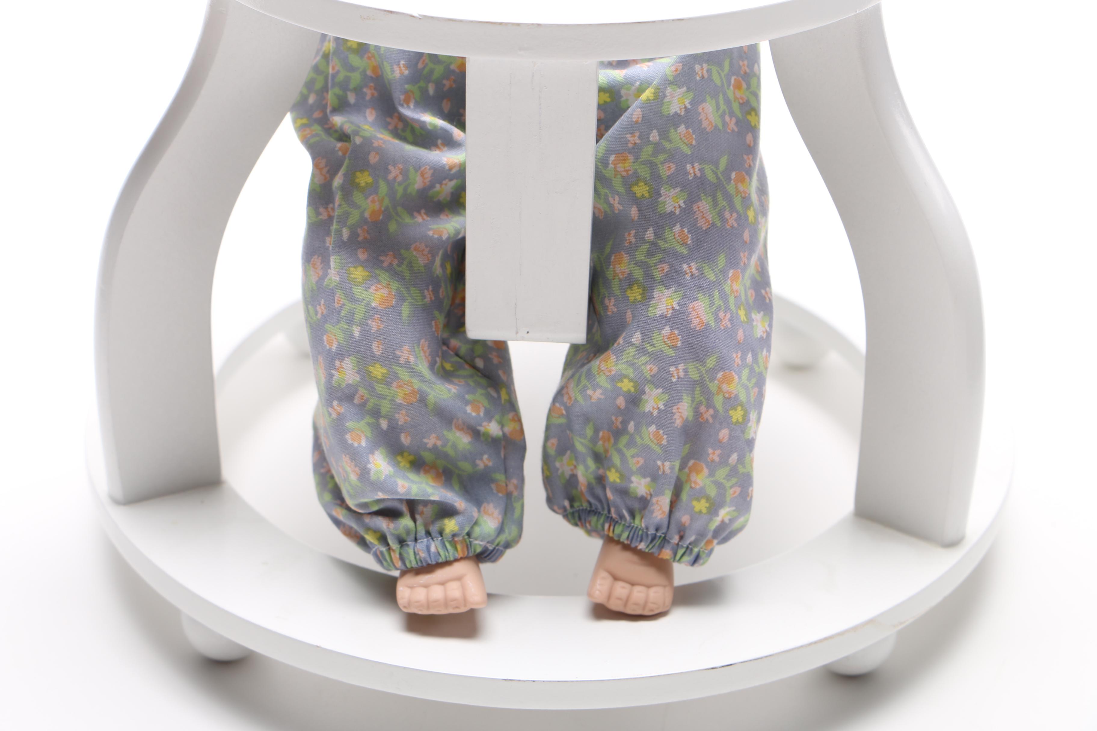 Porcelain Doll in Wooden Walker