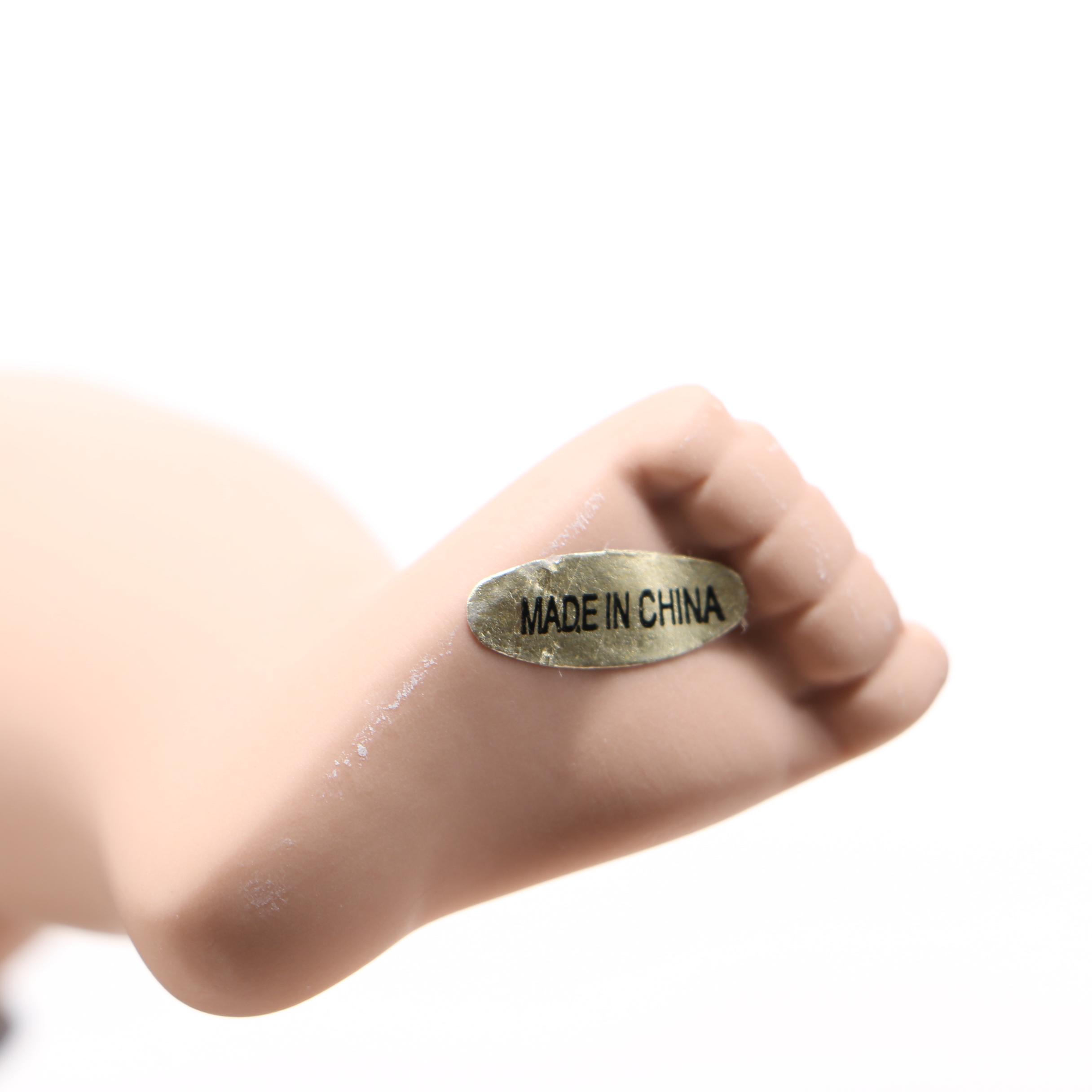 Porcelain Doll in Wooden Walker