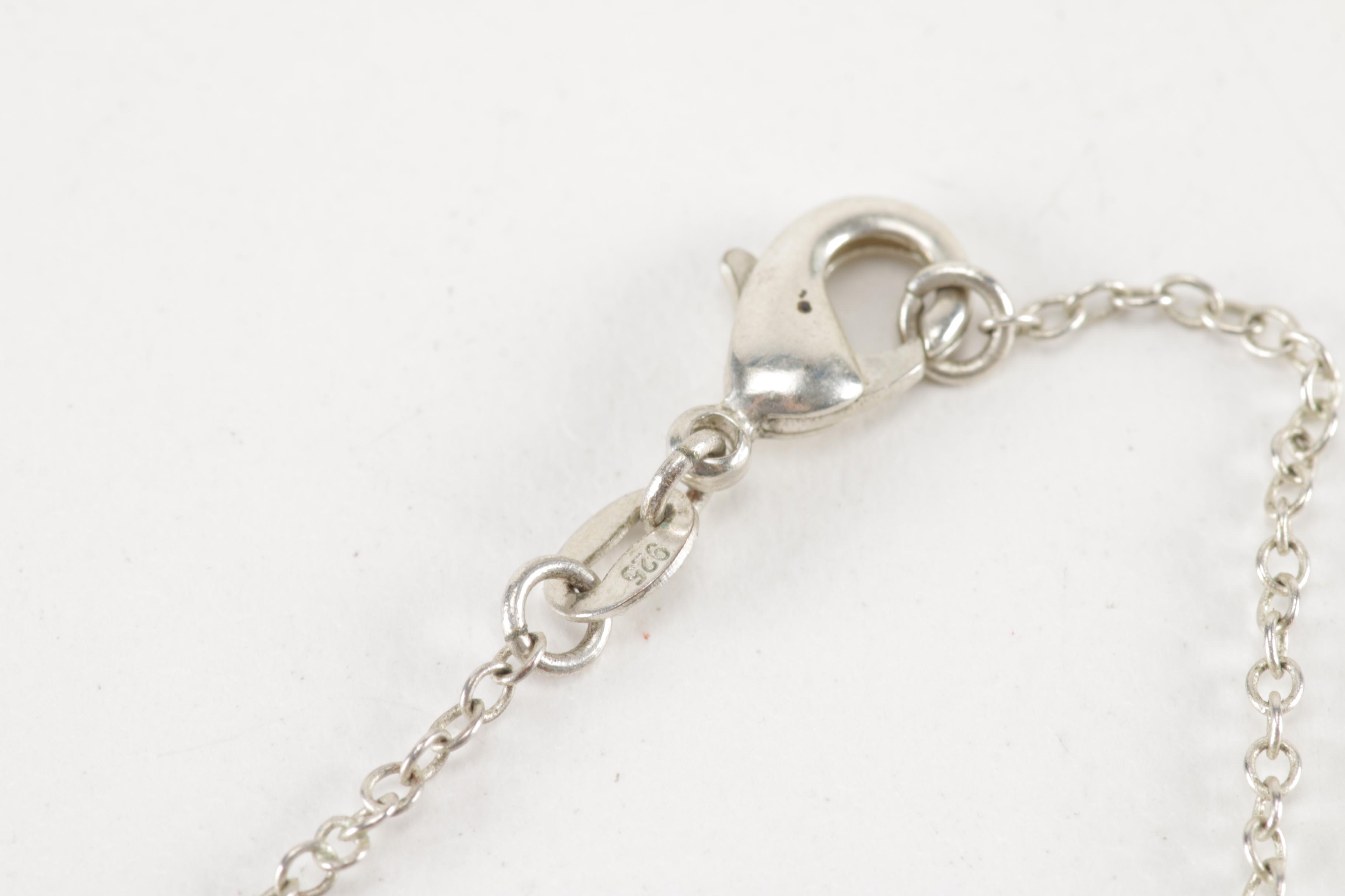 Sterling Silver Jewelry Including a Turquoise Pendant