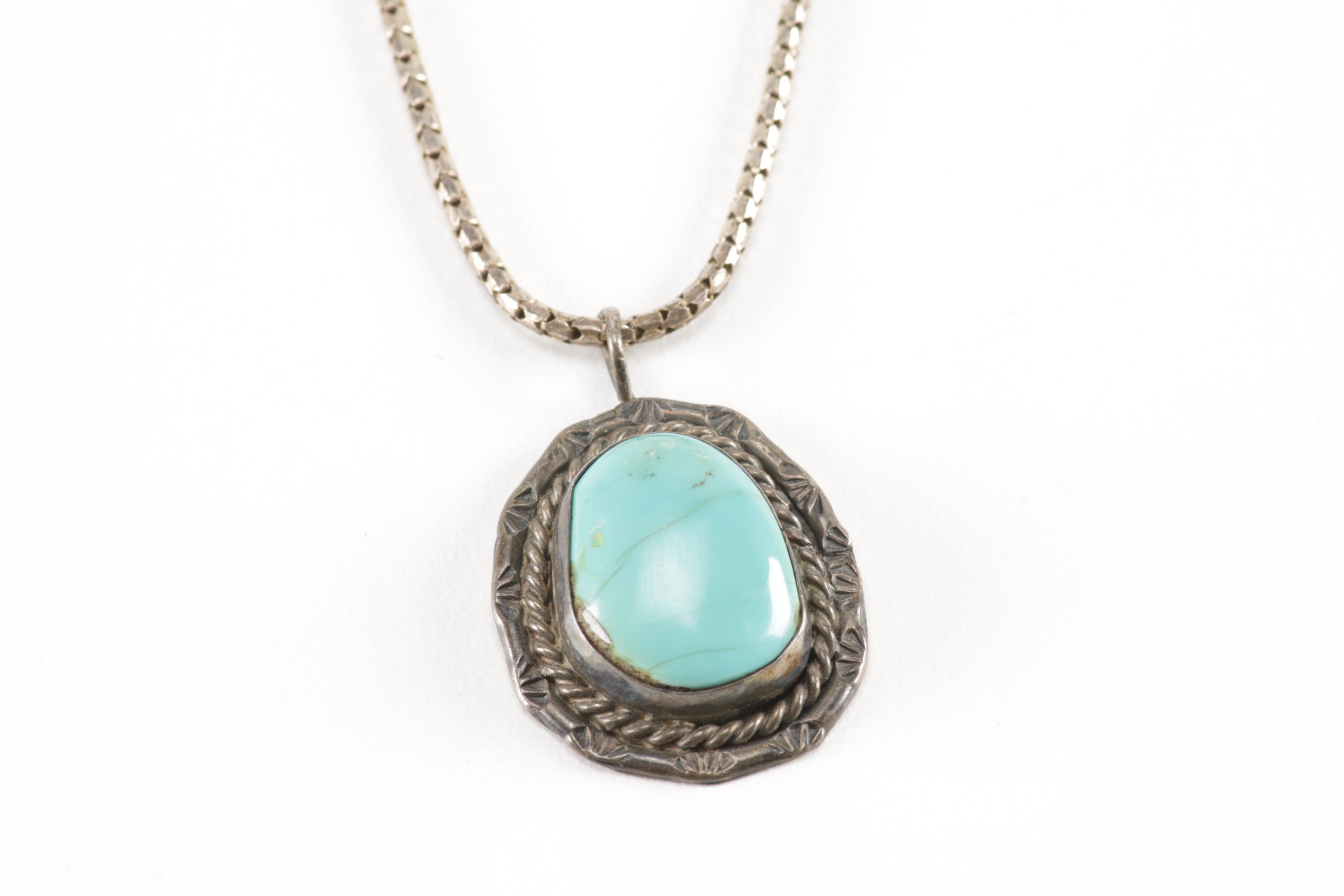 Sterling Silver Jewelry Including a Turquoise Pendant