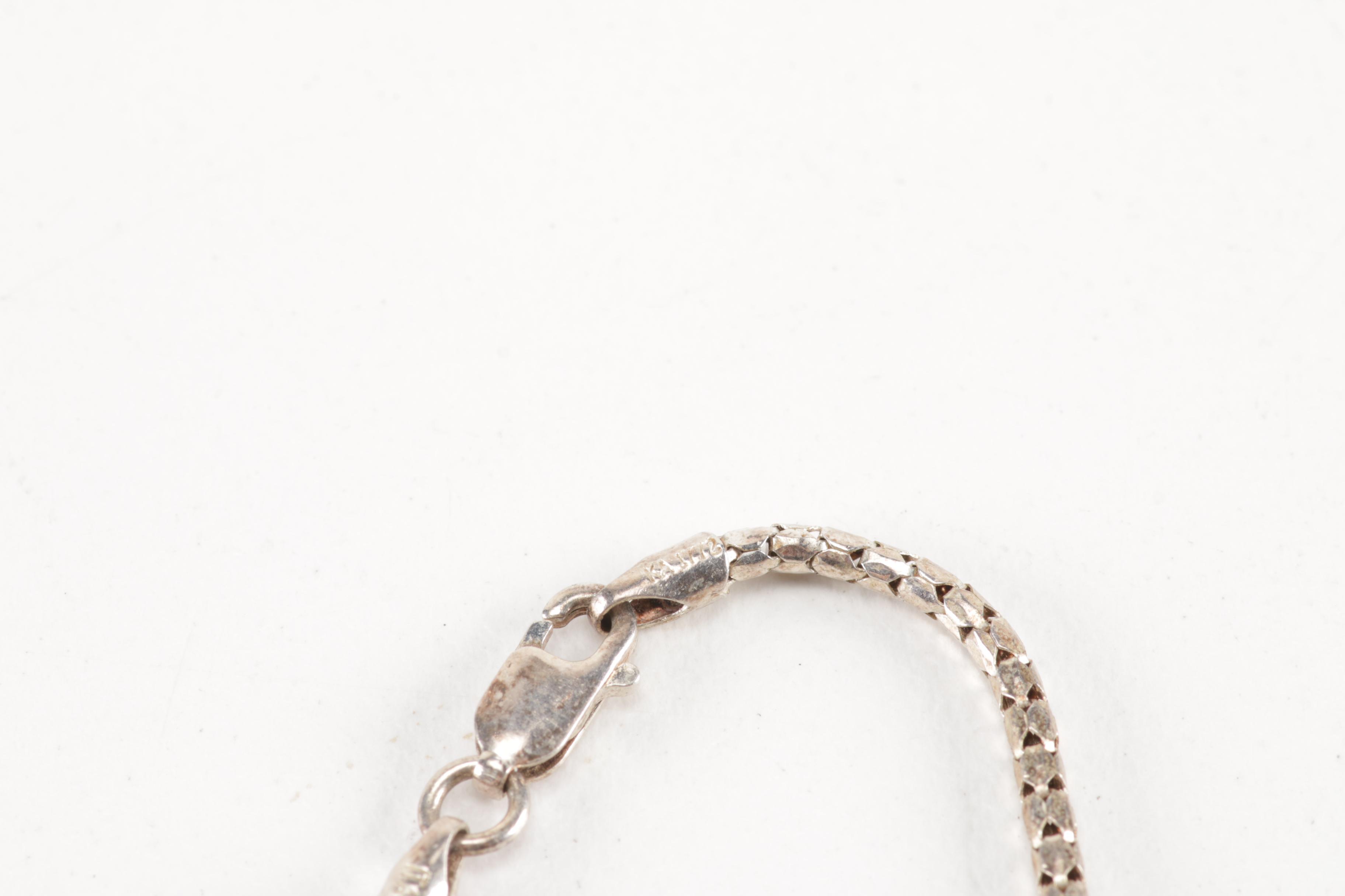 Sterling Silver Jewelry Including a Turquoise Pendant