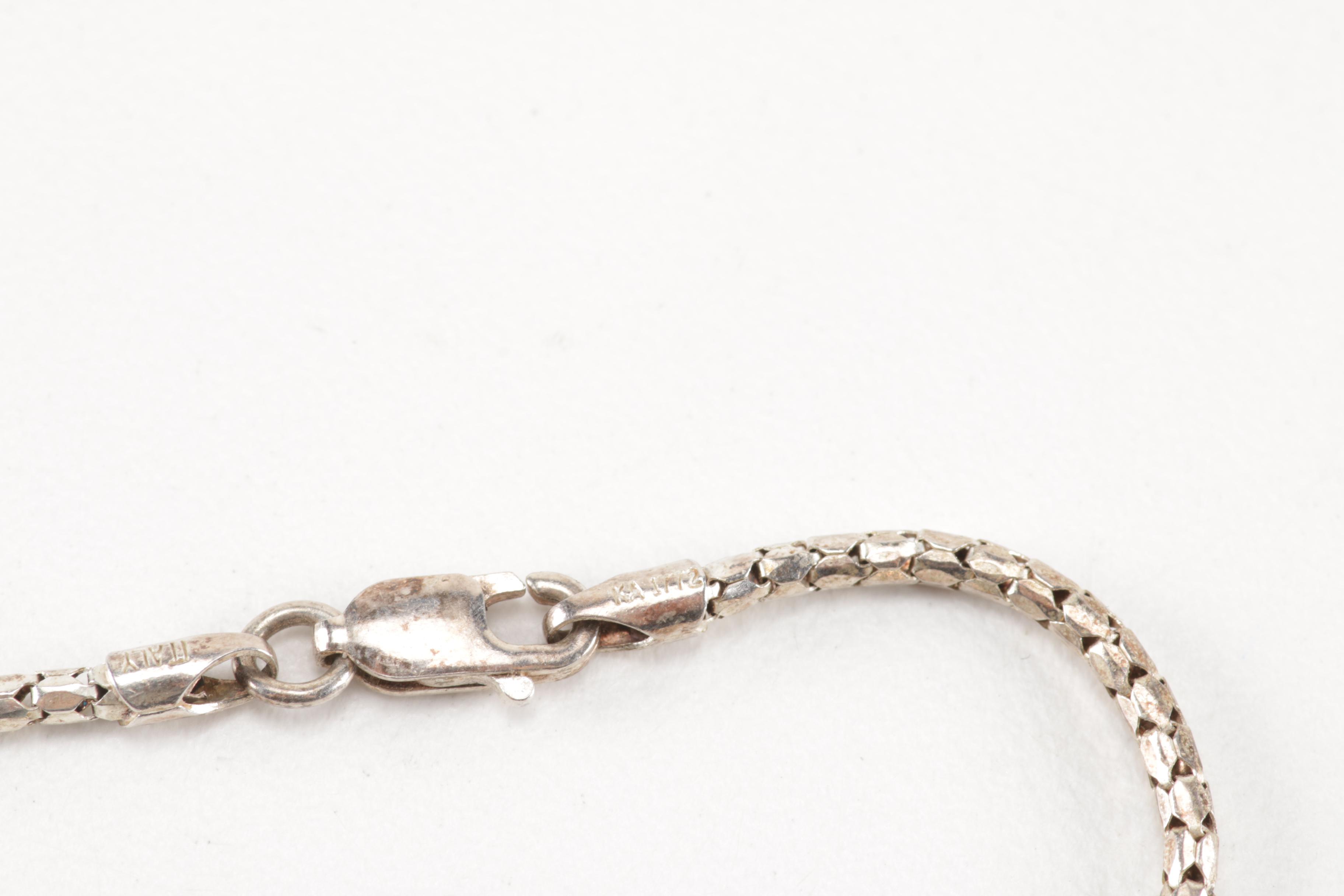 Sterling Silver Jewelry Including a Turquoise Pendant