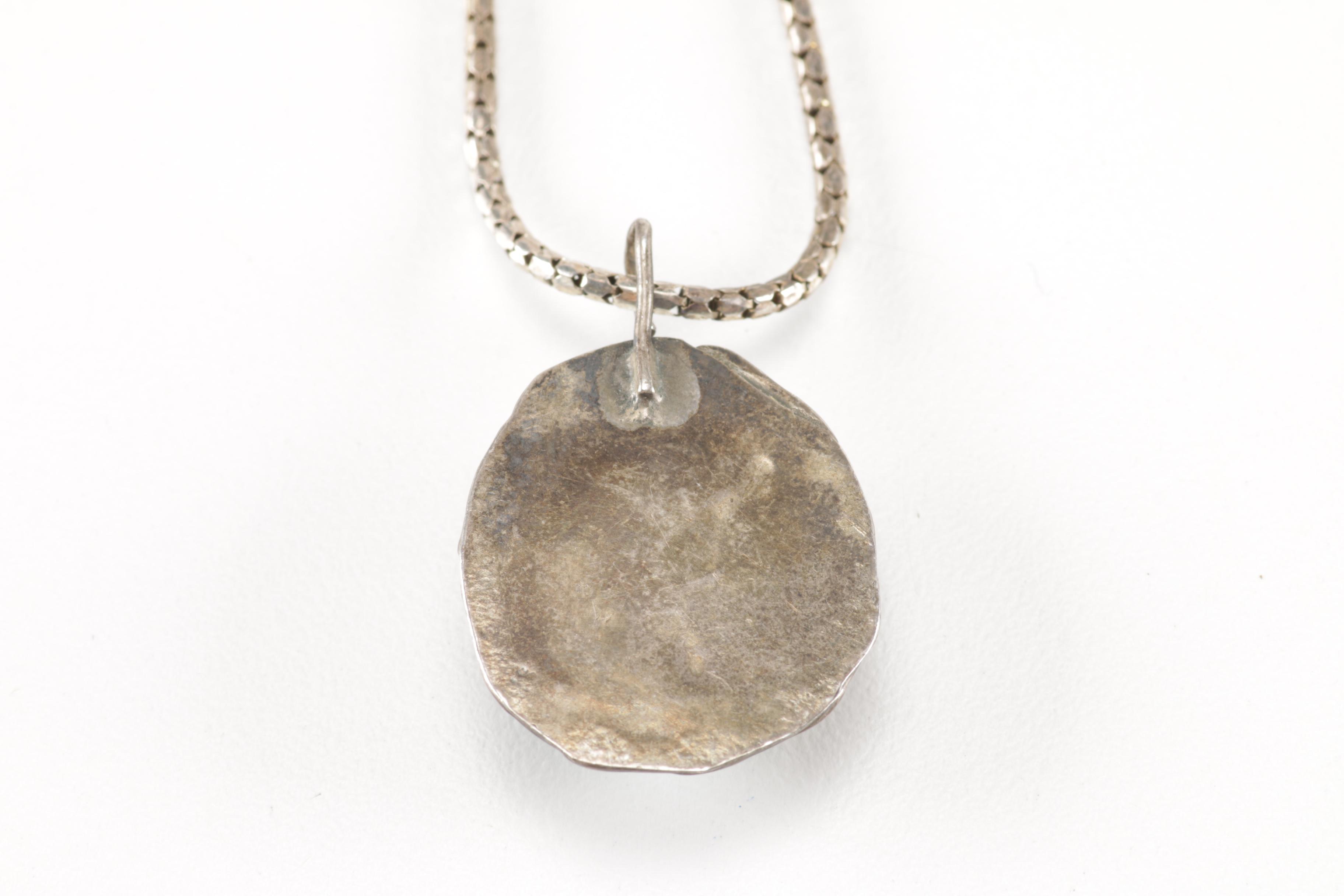 Sterling Silver Jewelry Including a Turquoise Pendant