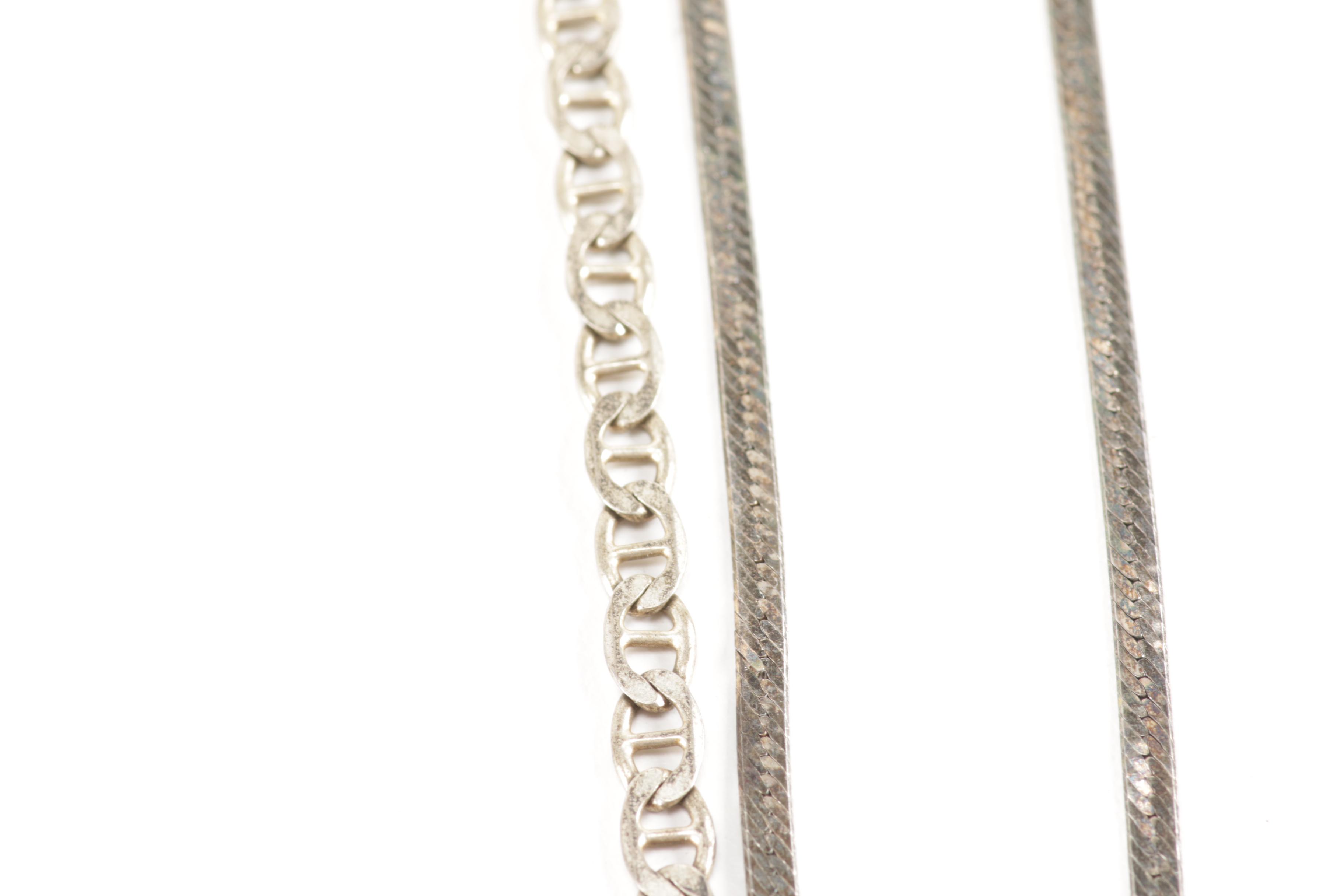Sterling Silver Jewelry Including a Turquoise Pendant