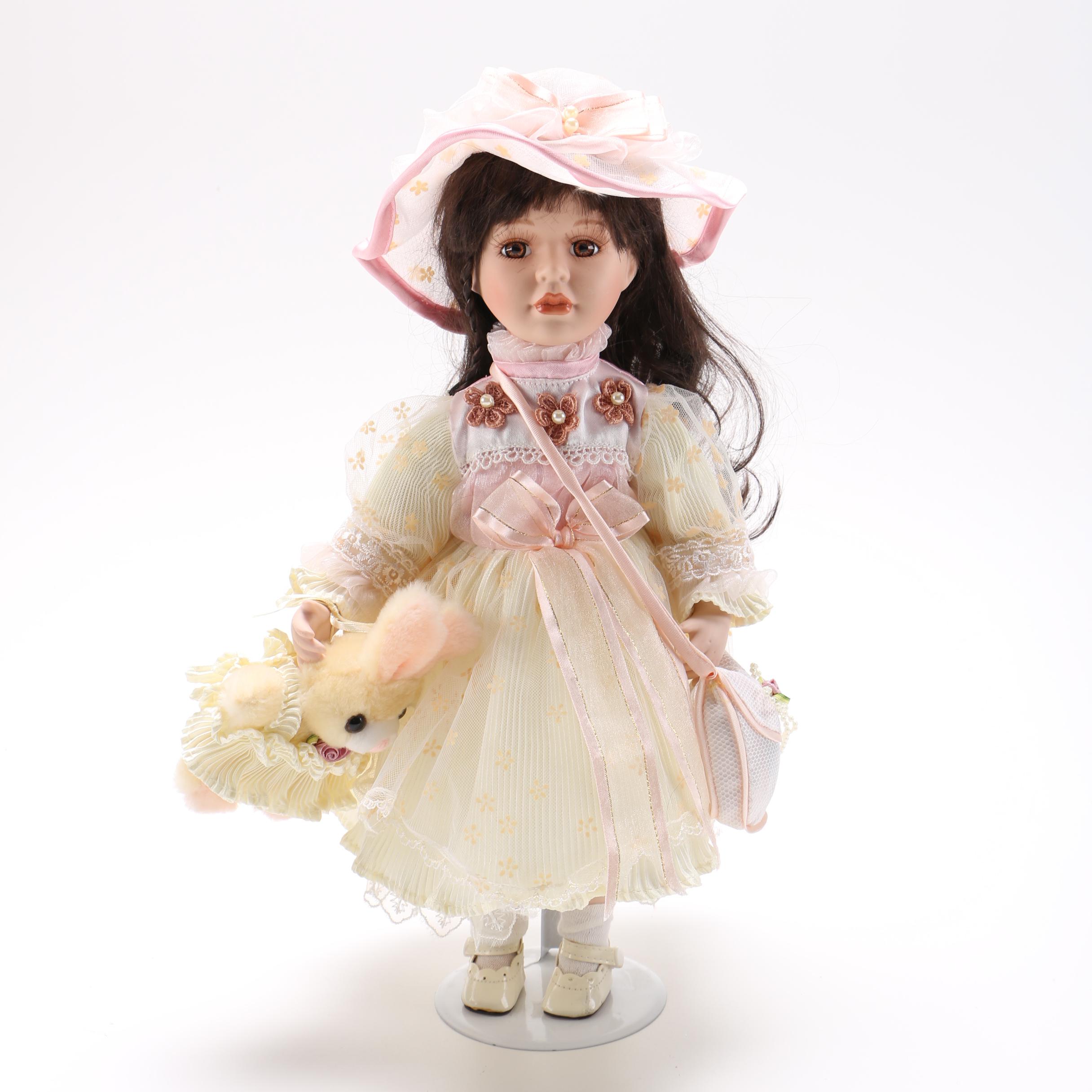 Porcelain Doll with Stuffed Rabbit