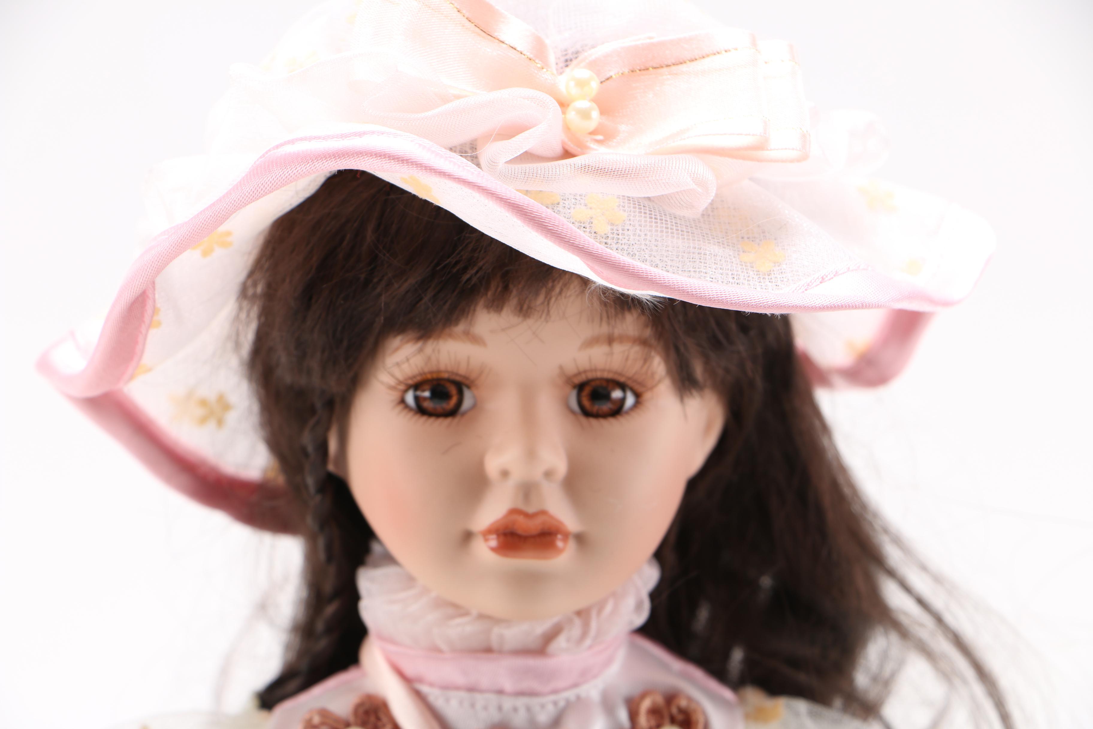 Porcelain Doll with Stuffed Rabbit