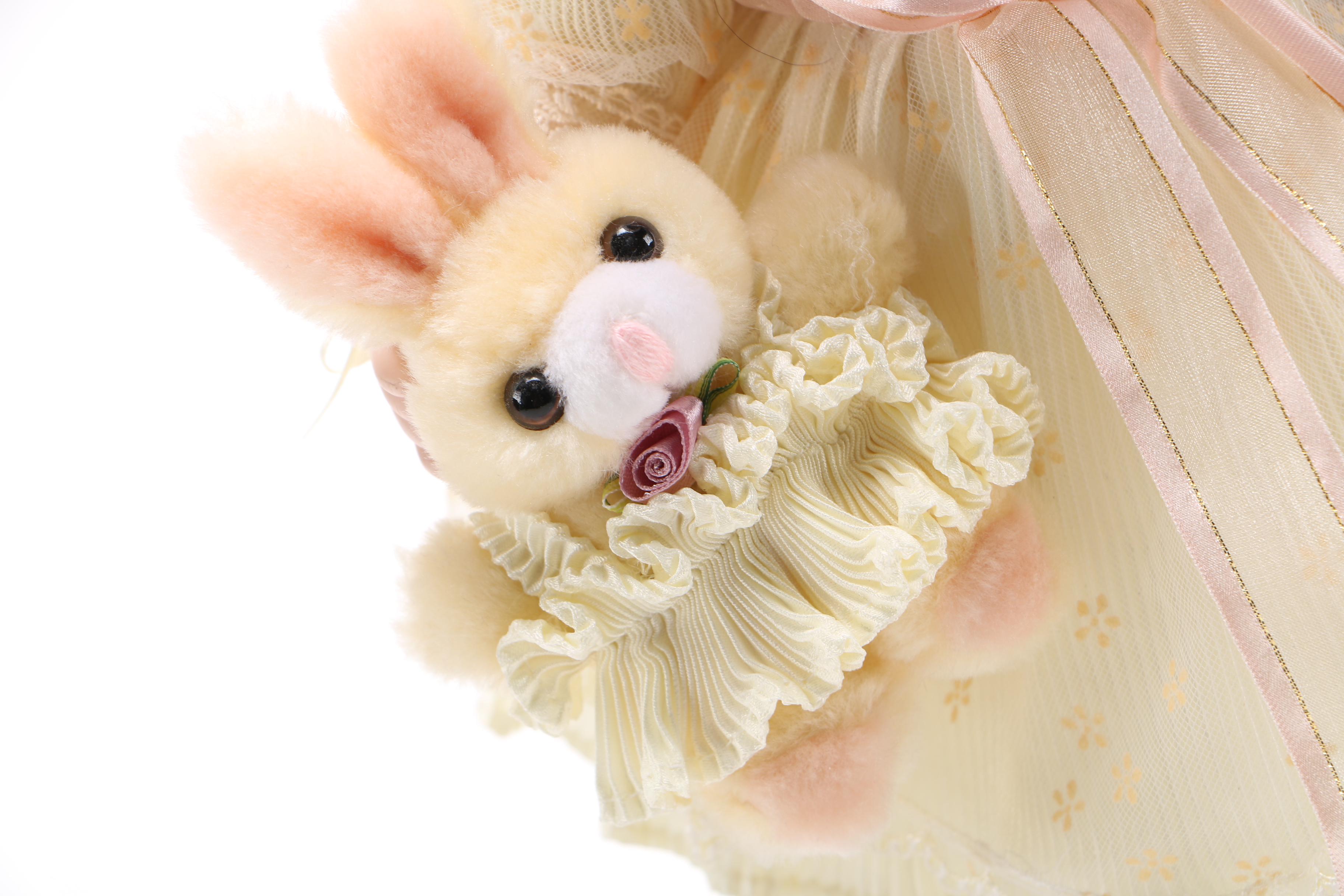 Porcelain Doll with Stuffed Rabbit