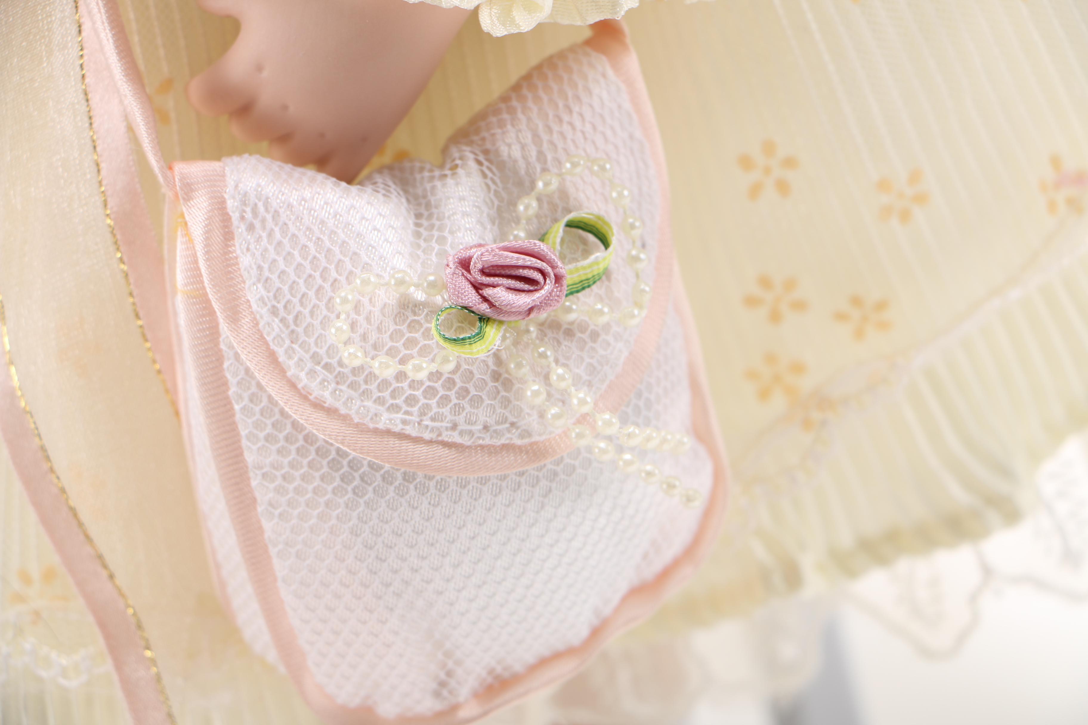 Porcelain Doll with Stuffed Rabbit