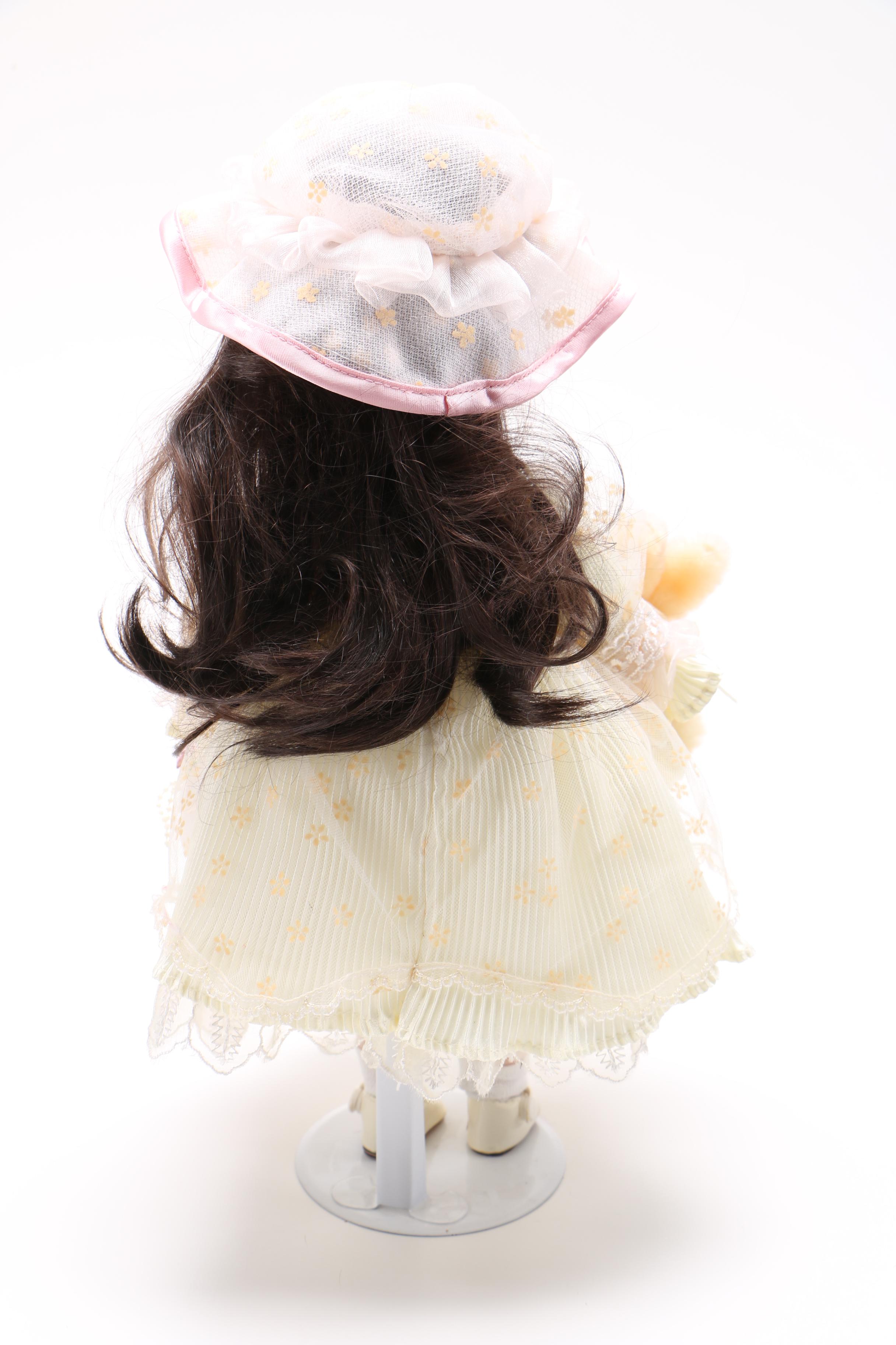 Porcelain Doll with Stuffed Rabbit