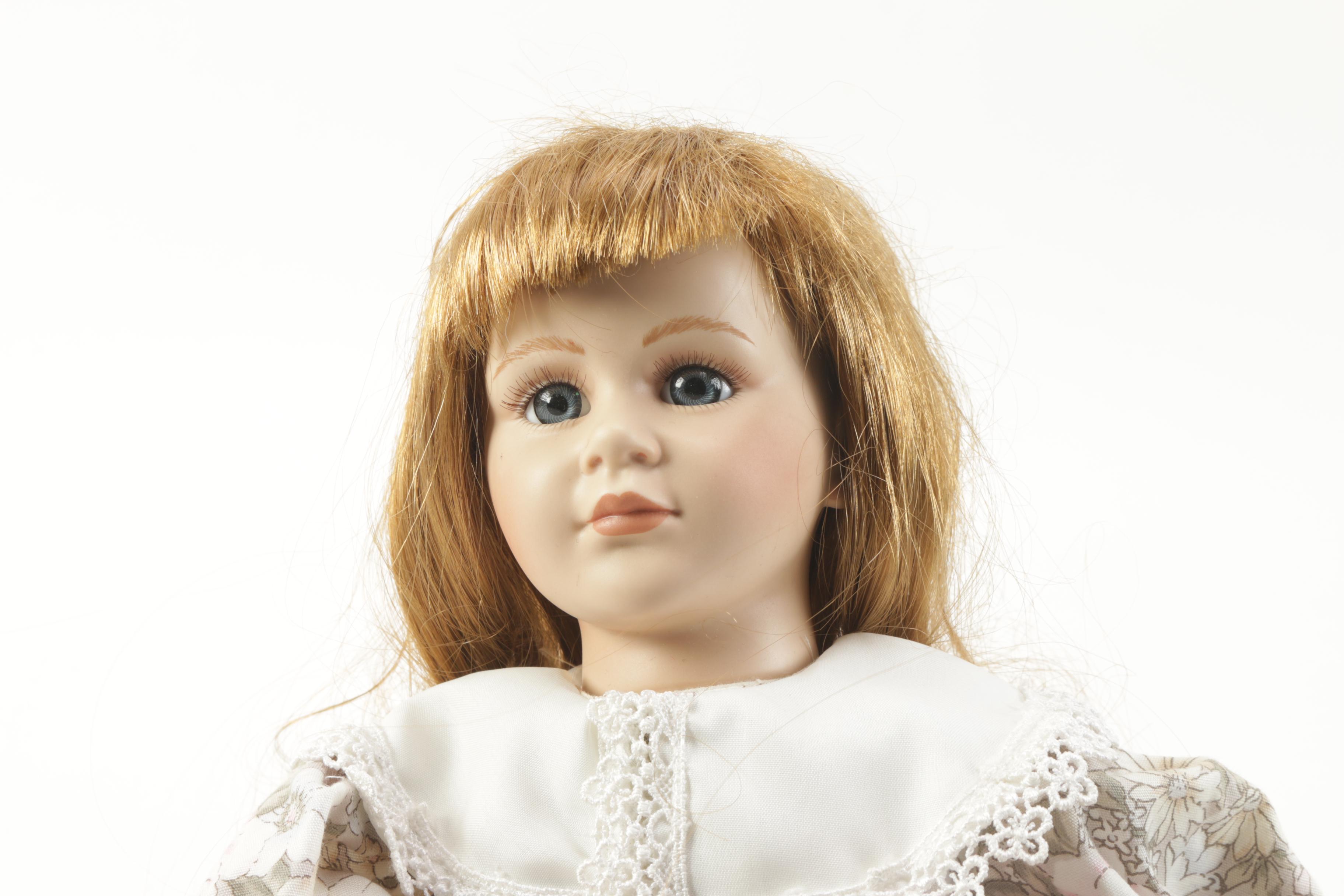 Porcelain Doll in Chair