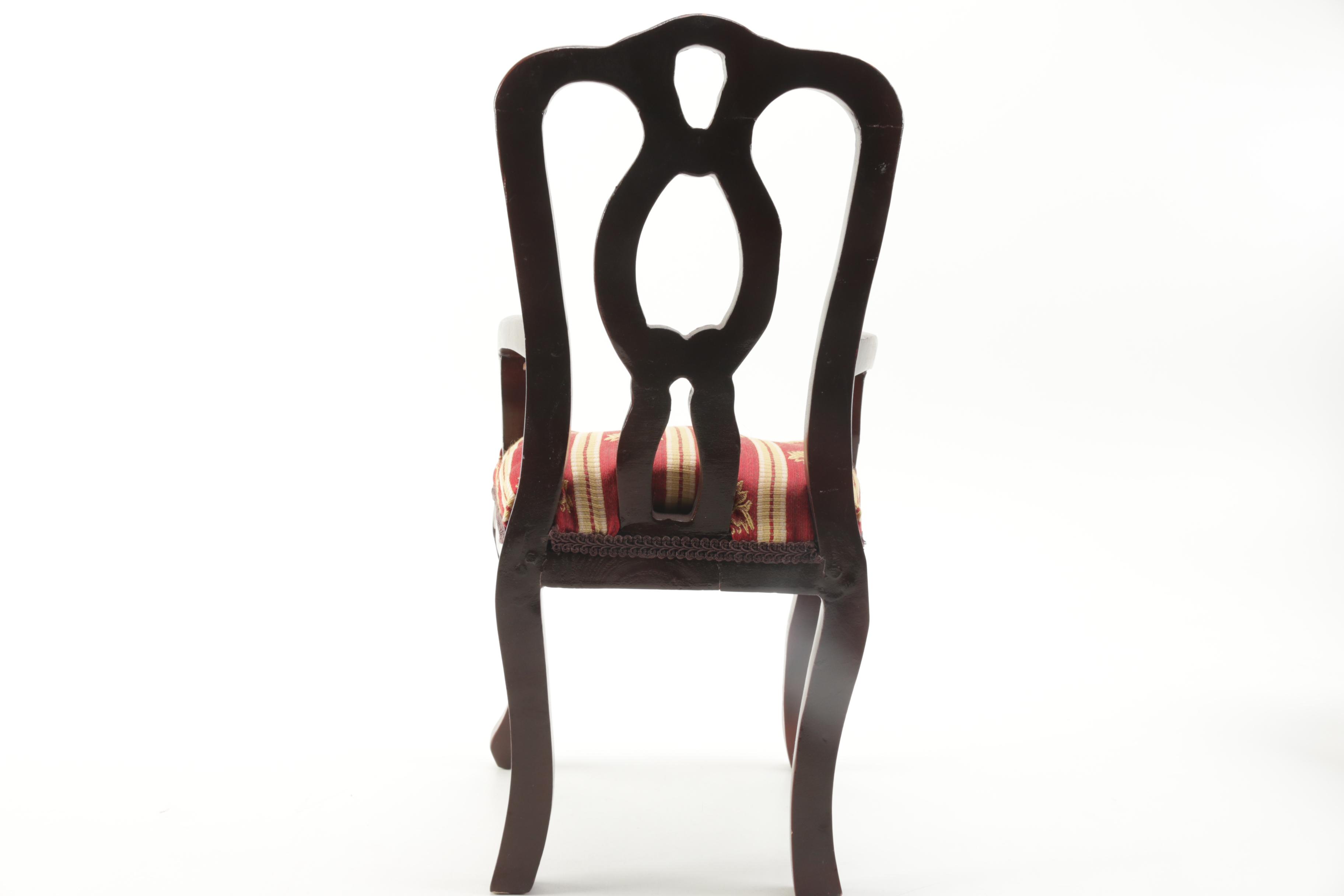 Porcelain Doll in Chair