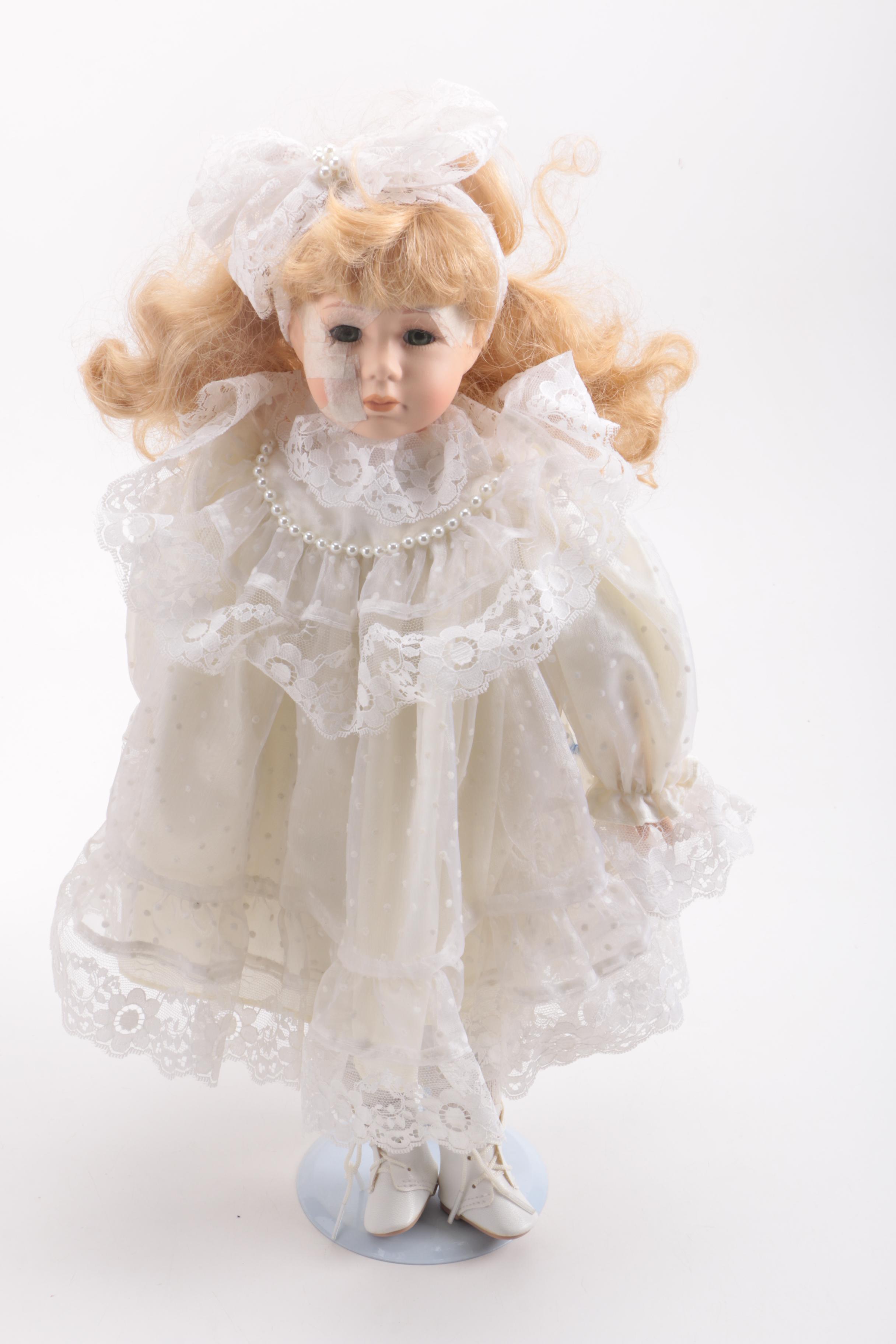 Assortment of Dolls and a Ceramic Toy Figurine