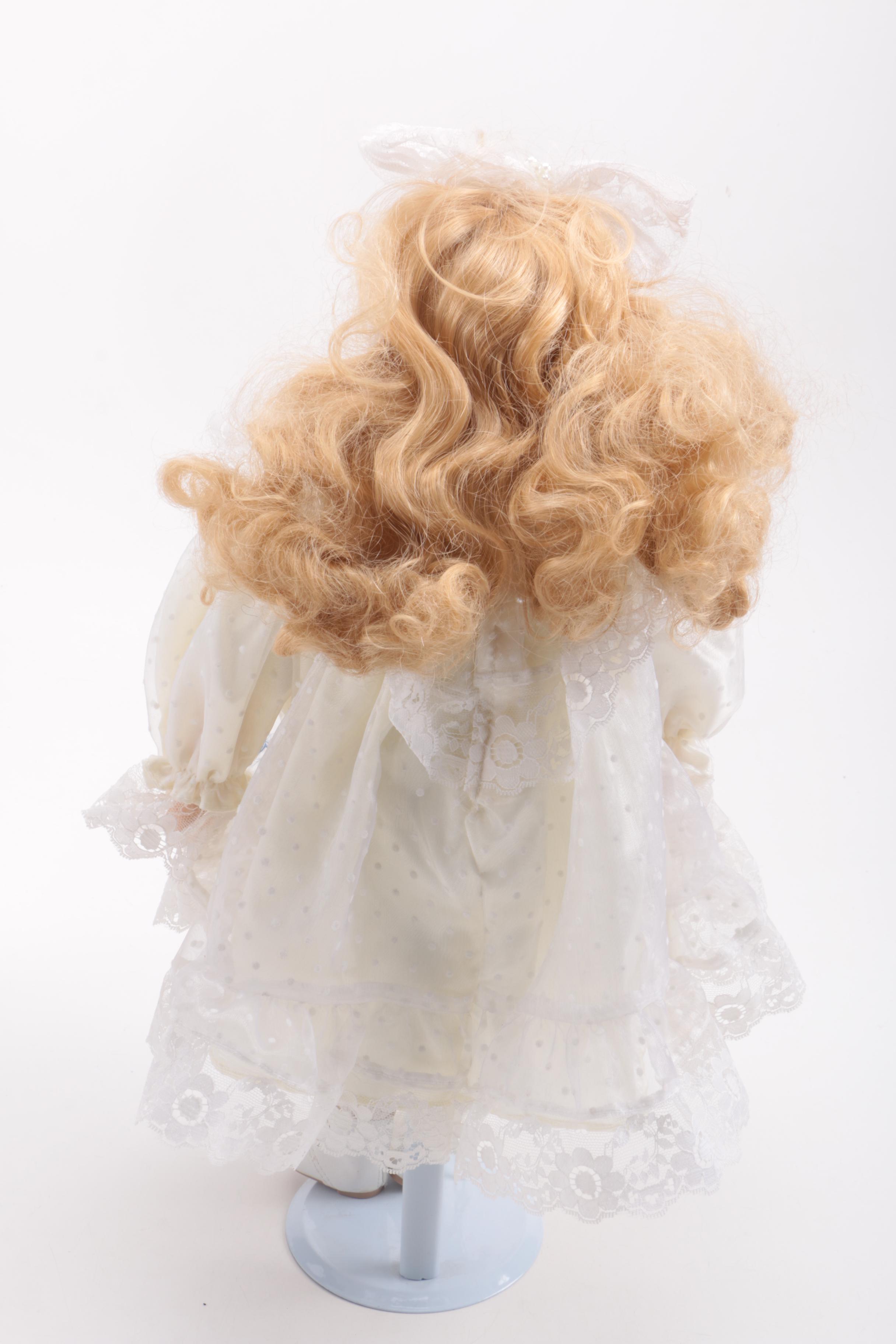 Assortment of Dolls and a Ceramic Toy Figurine