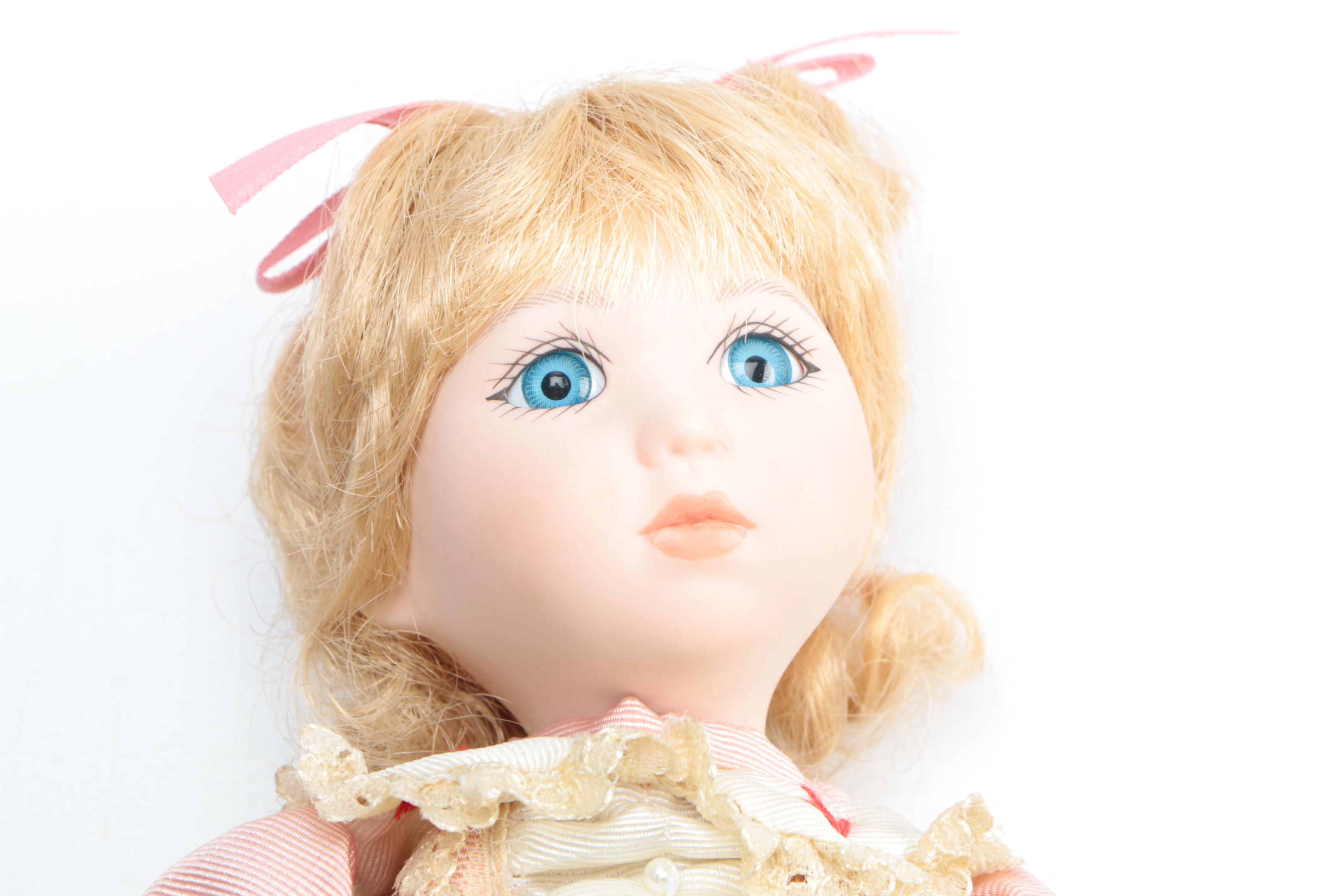 Set of Three Porcelain Dolls