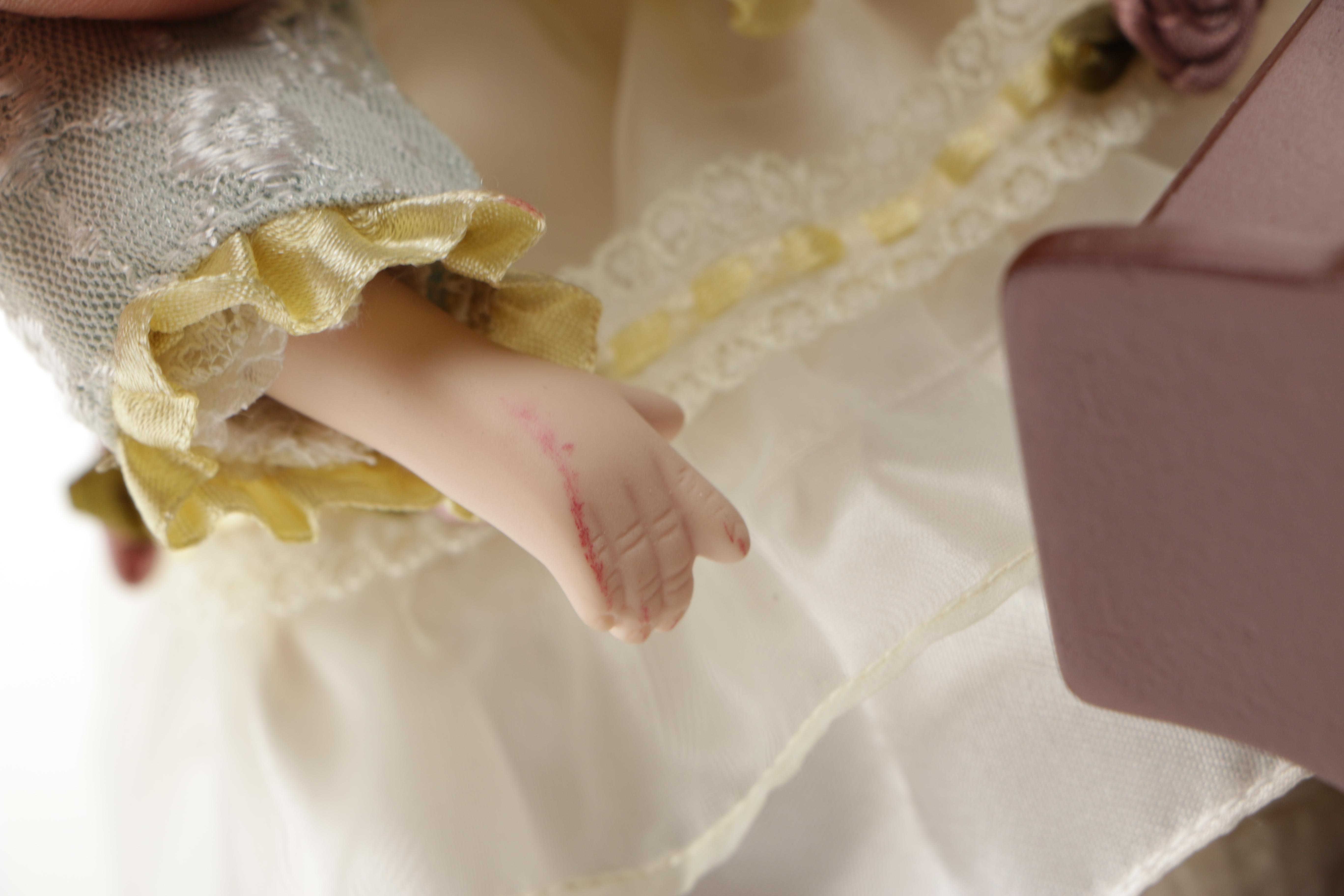 Porcelain Doll Playing Piano