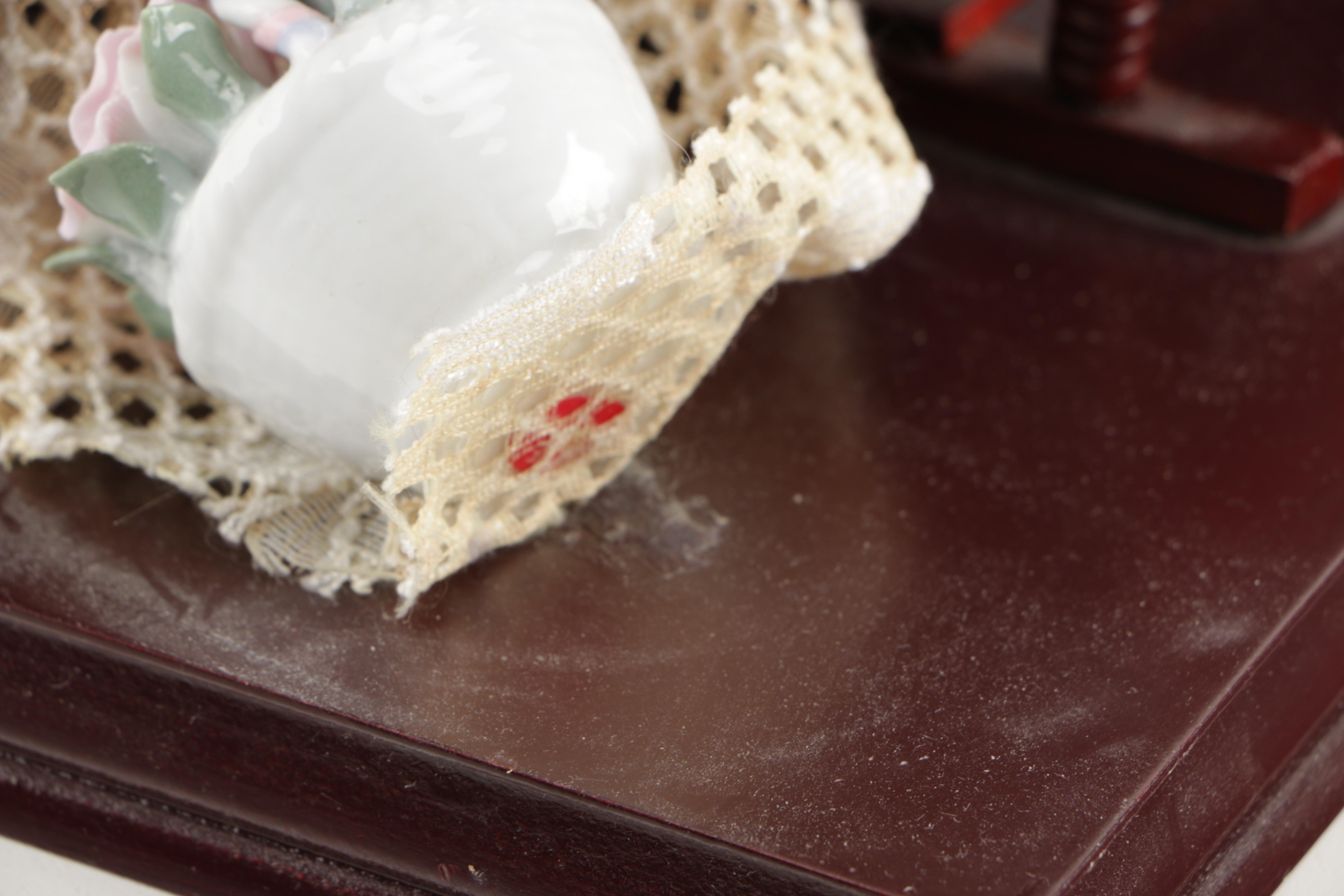 Porcelain Doll and Attached Accessories