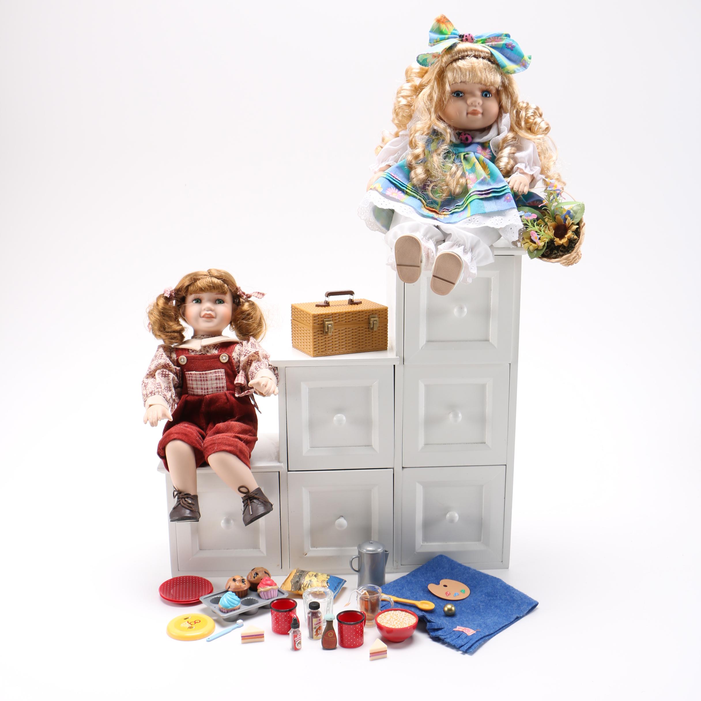 Porcelain Dolls and Accessories in Dresser