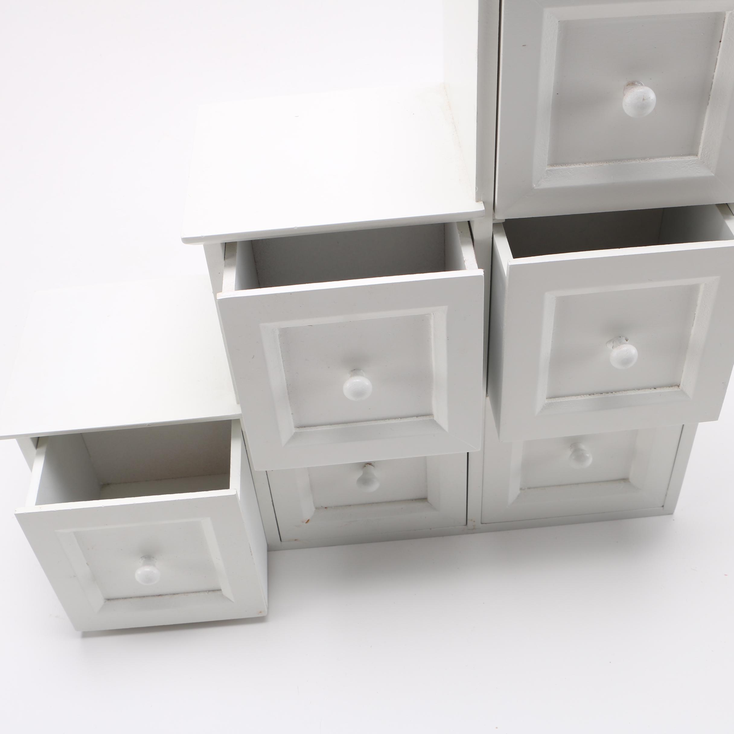 Porcelain Dolls and Accessories in Dresser