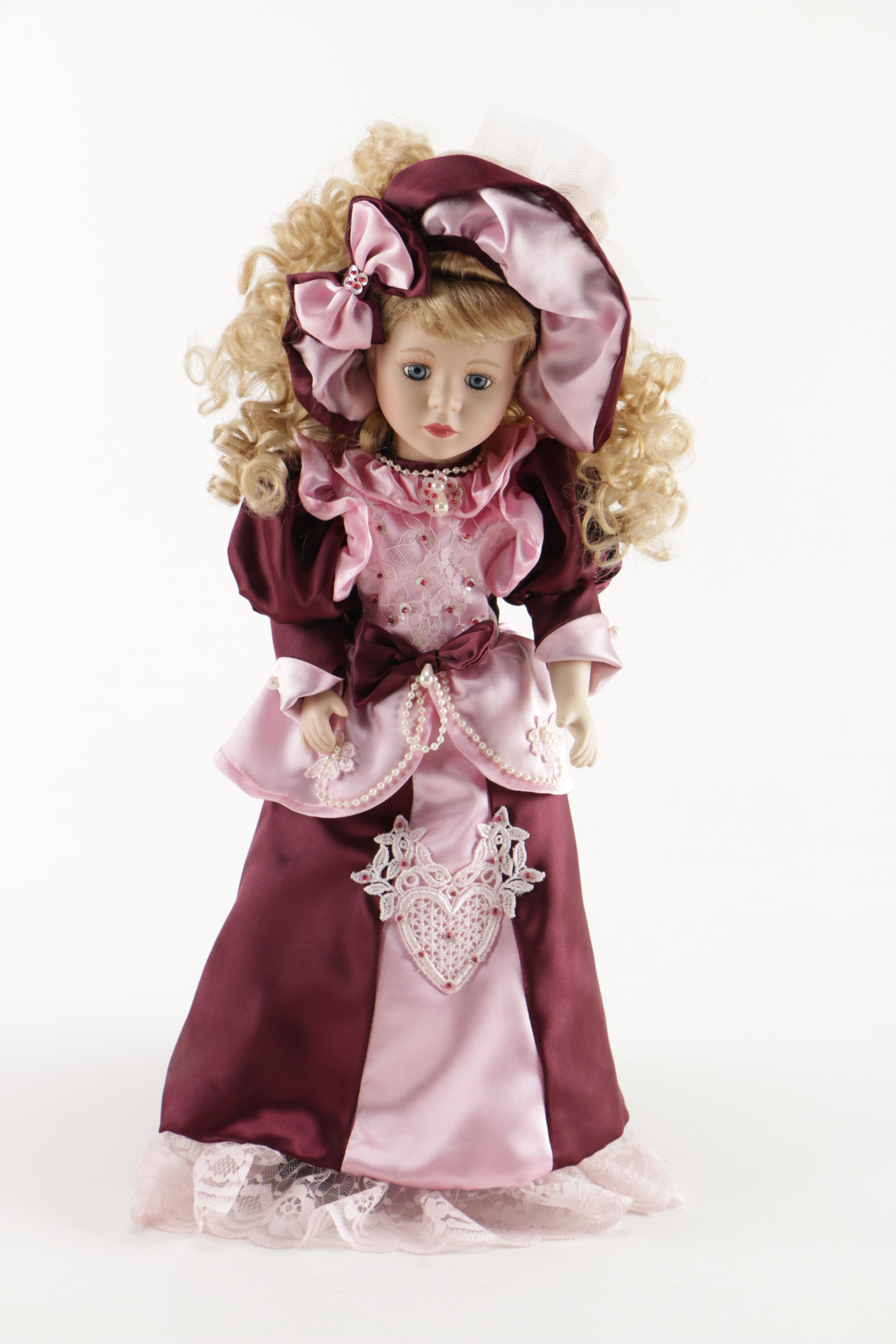 Assortment of Porcelain Dolls in Pink Dresses