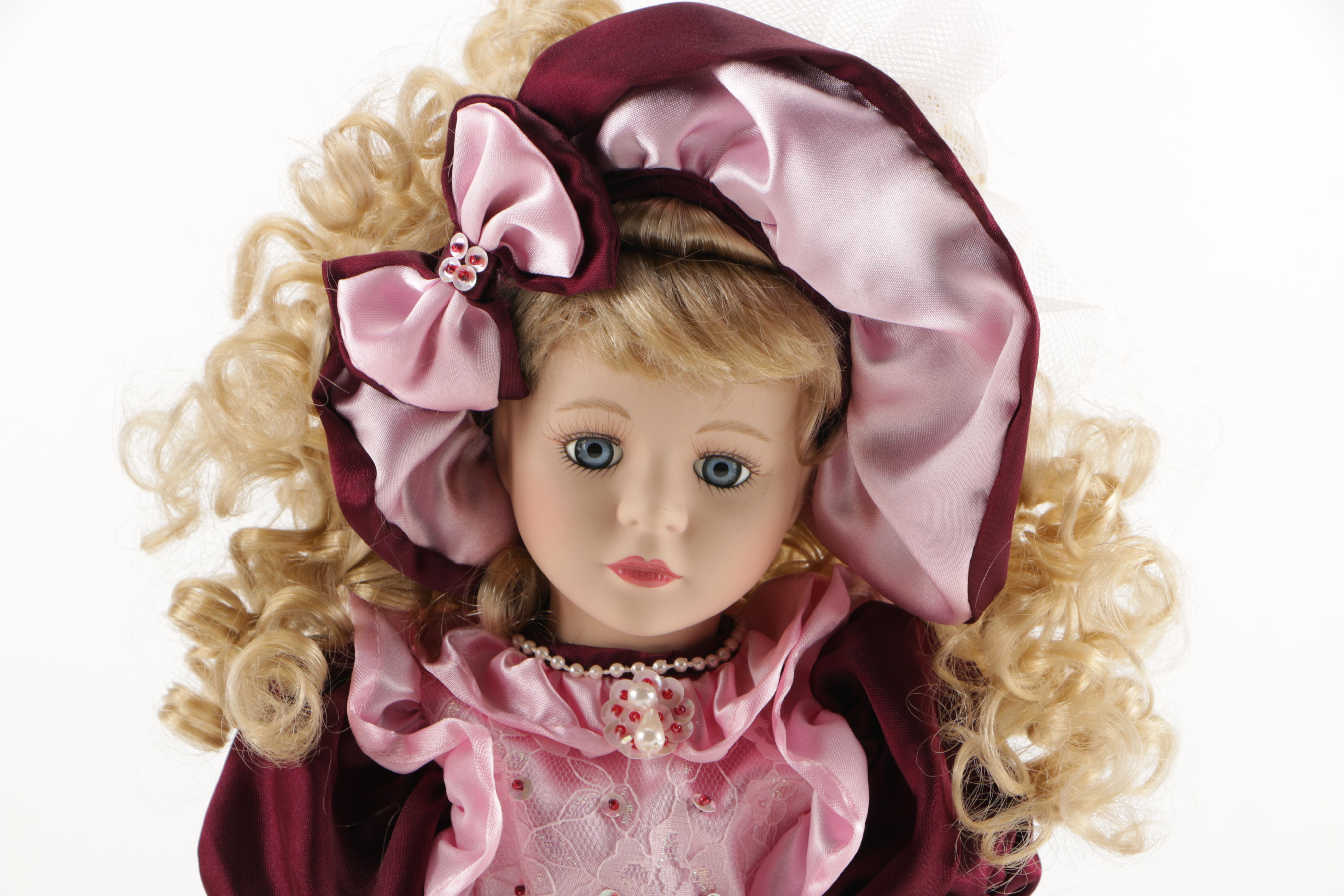 Assortment of Porcelain Dolls in Pink Dresses