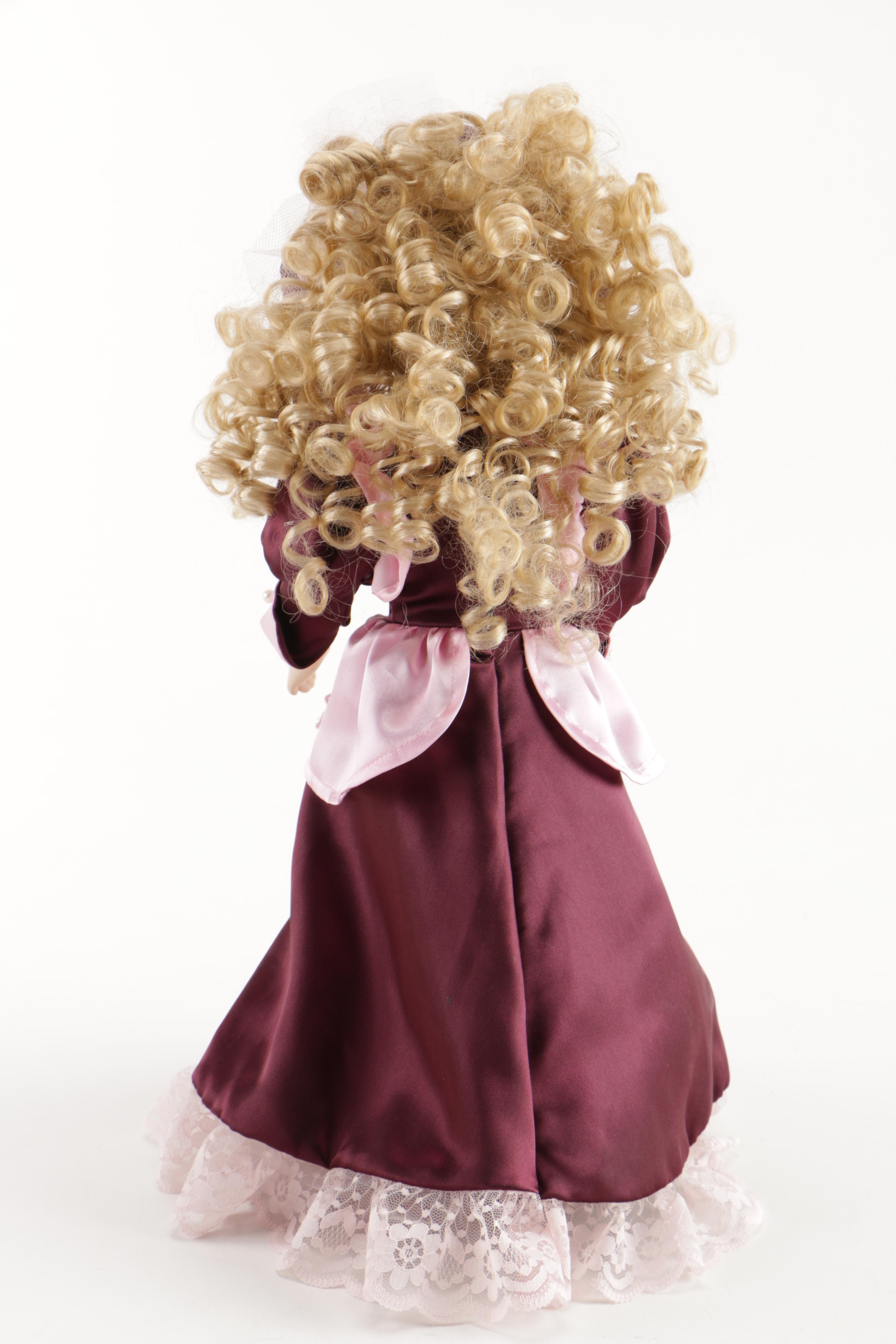 Assortment of Porcelain Dolls in Pink Dresses