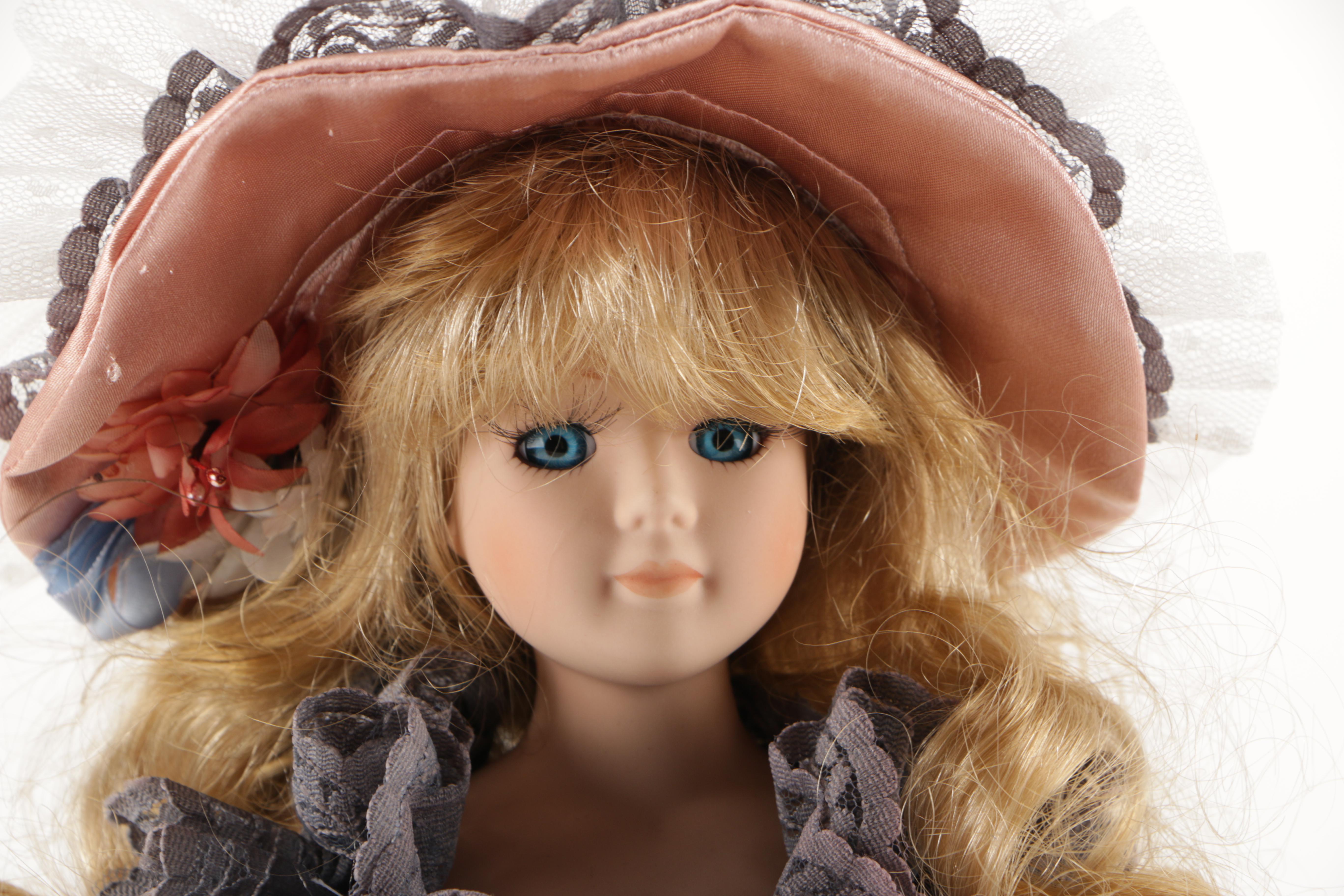 Assortment of Porcelain Dolls in Pink Dresses