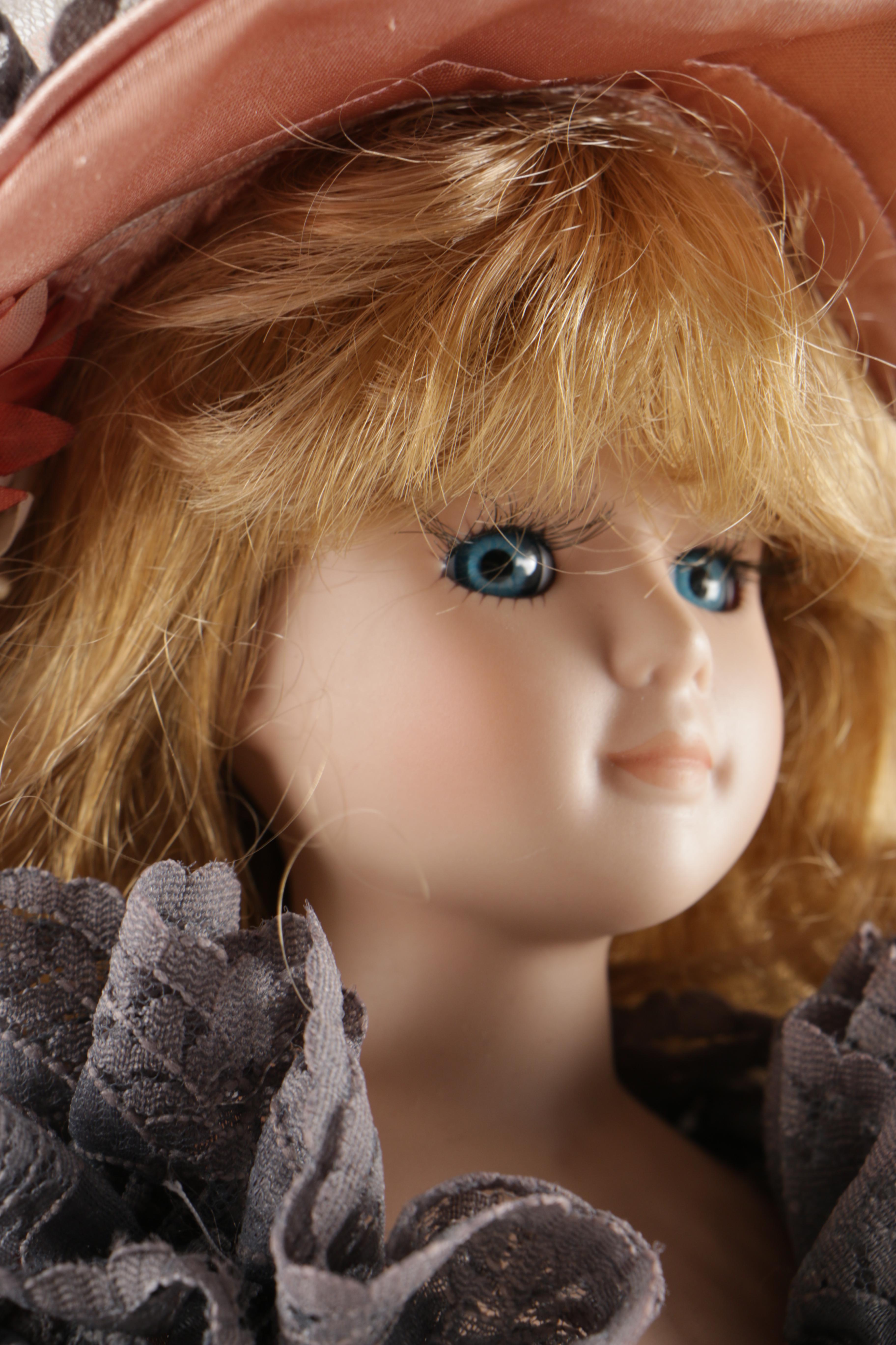 Assortment of Porcelain Dolls in Pink Dresses