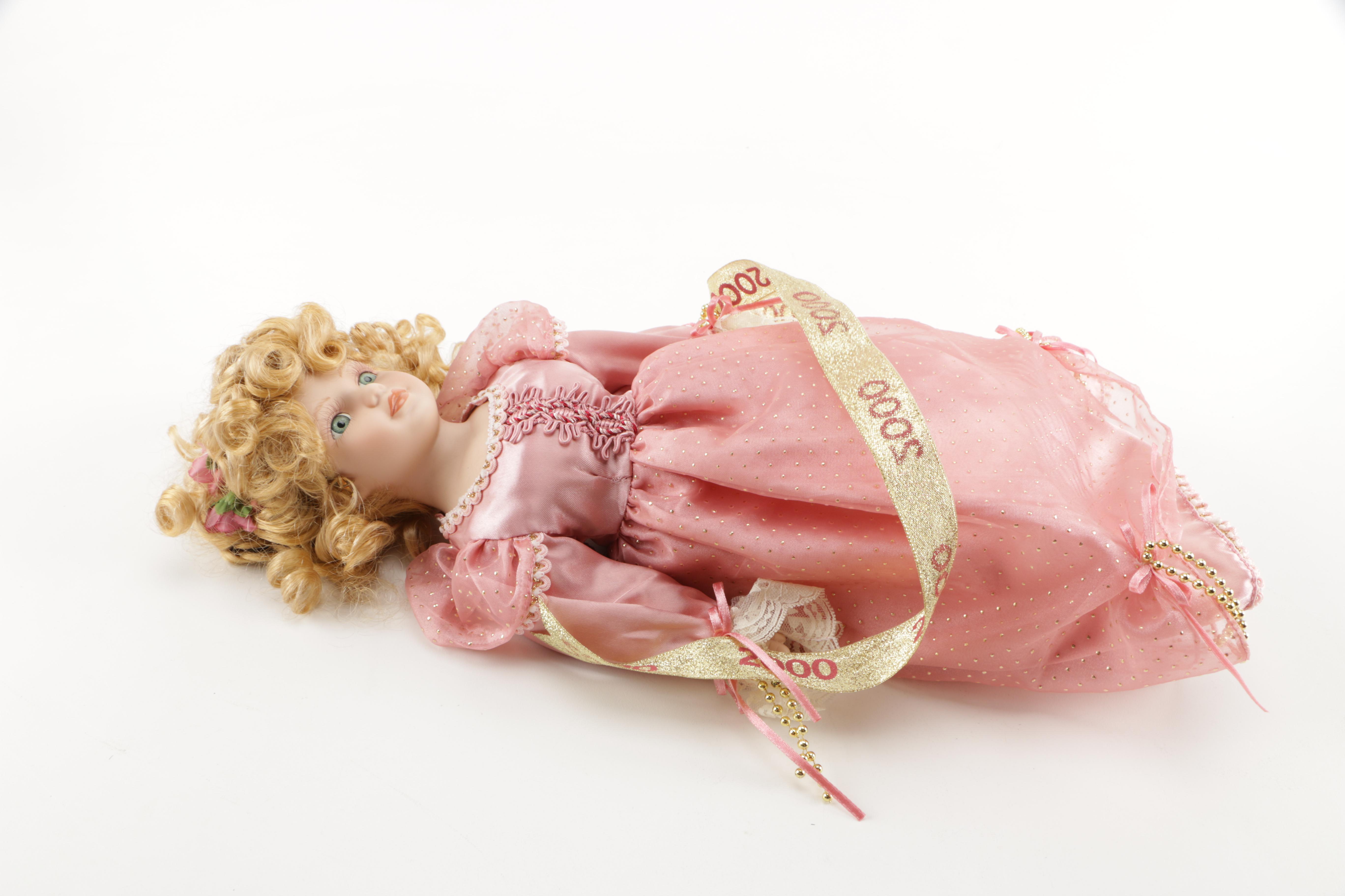 Assortment of Porcelain Dolls in Pink Dresses