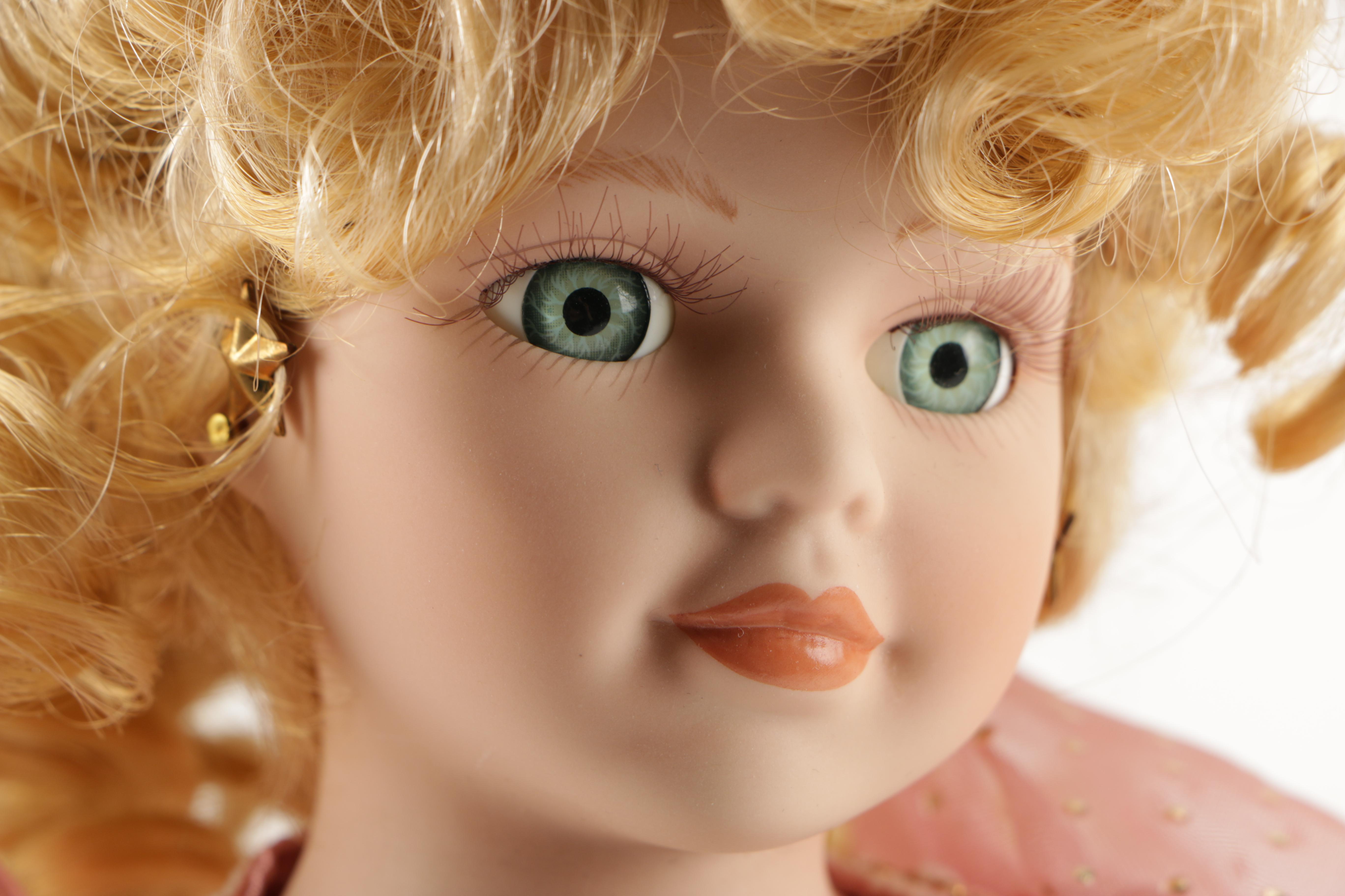 Assortment of Porcelain Dolls in Pink Dresses