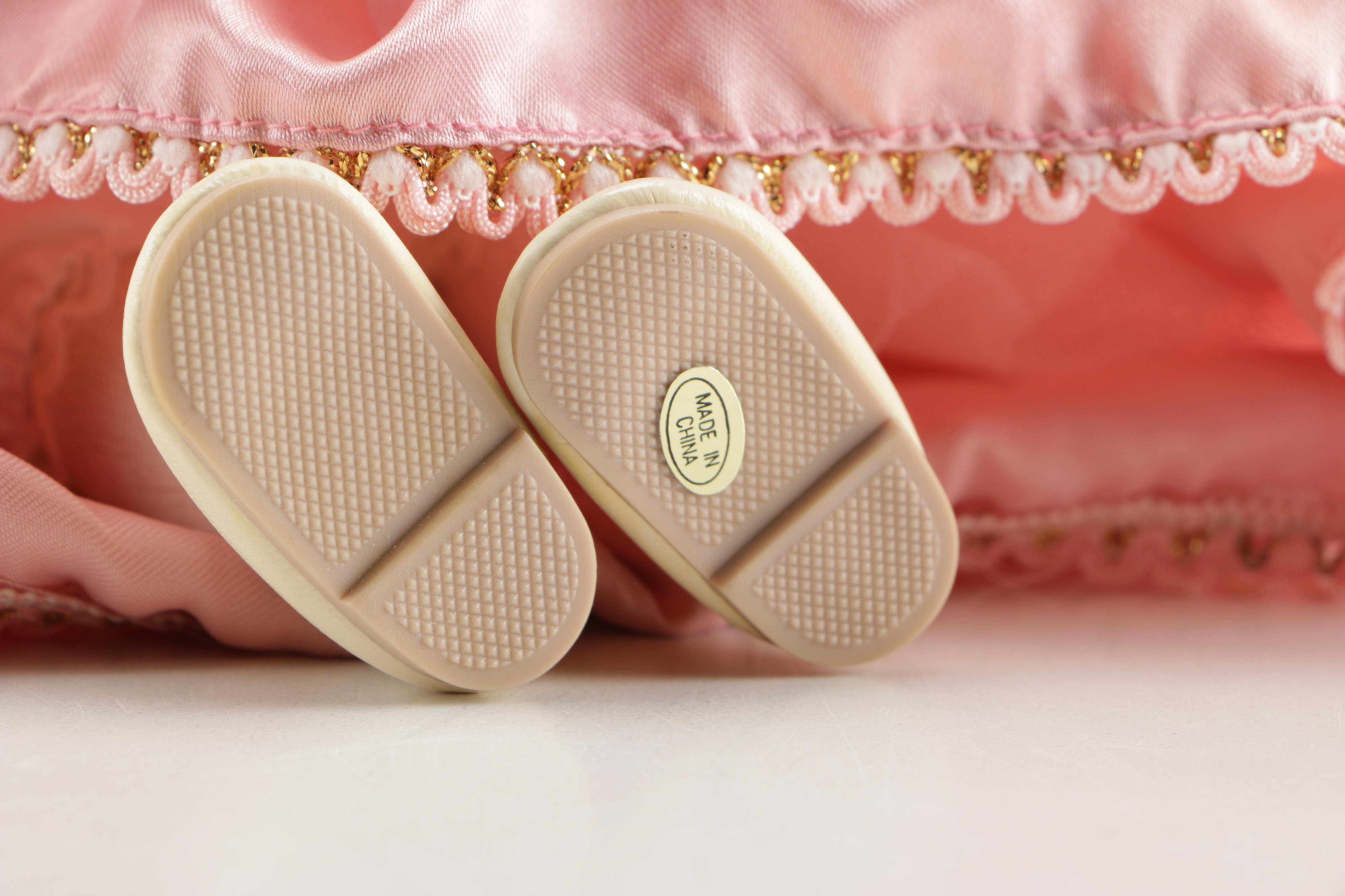 Assortment of Porcelain Dolls in Pink Dresses