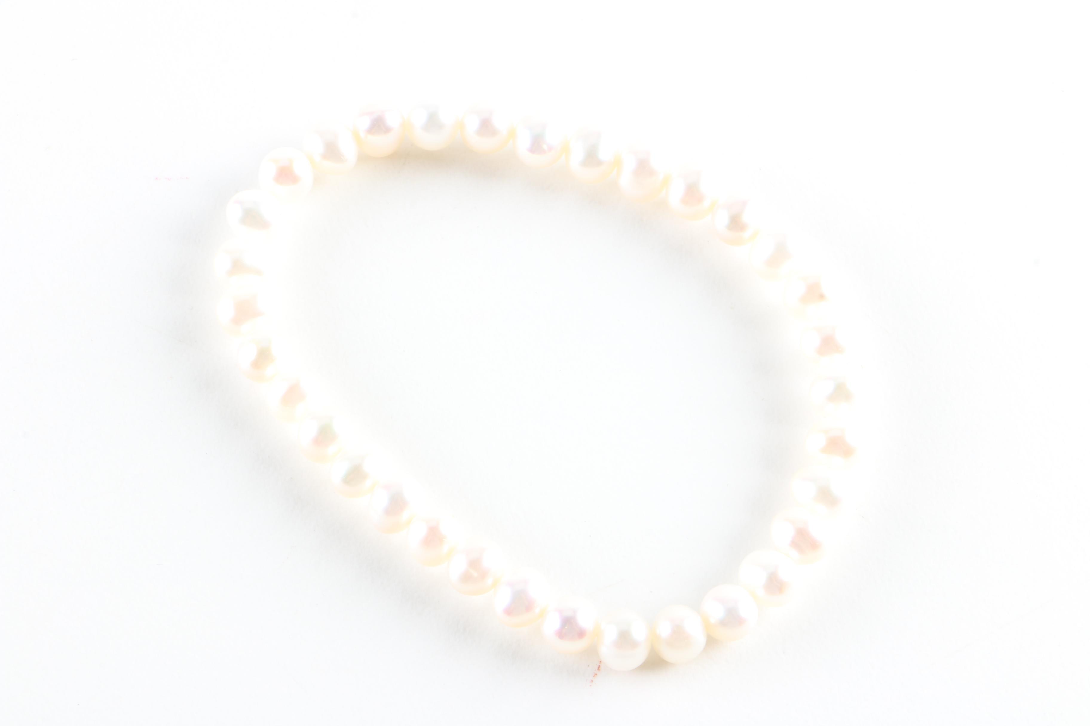 Vintage Brooches, Earrings, and a Pearl Bracelet