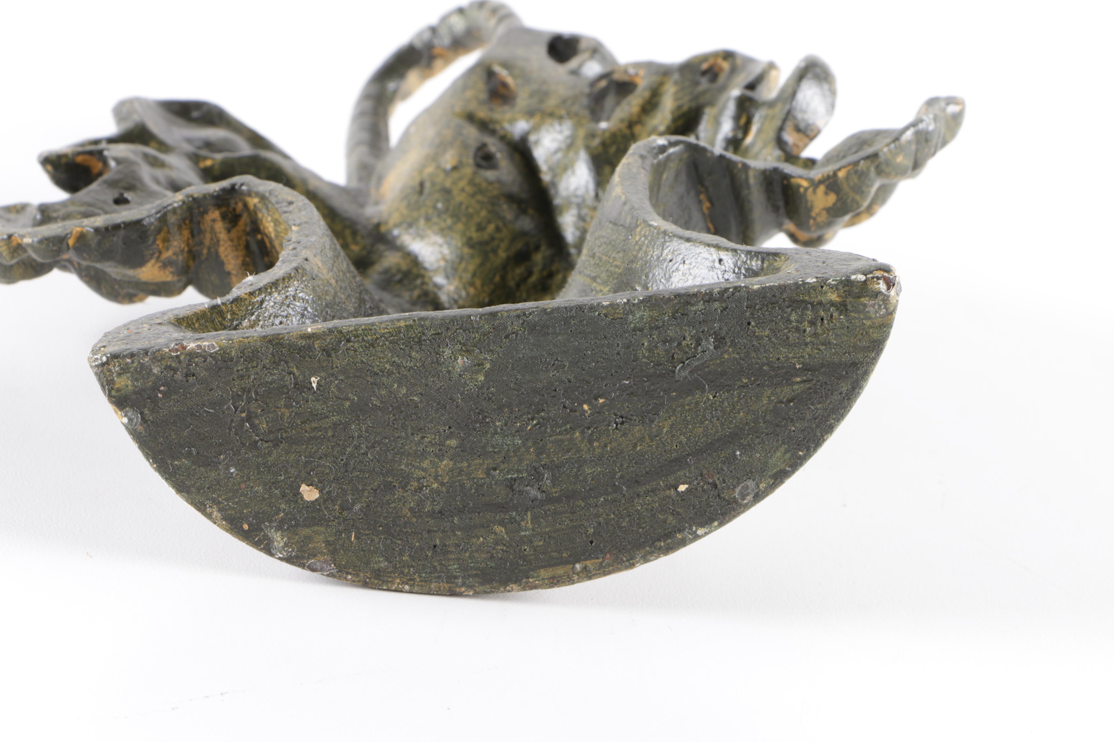 Cast Iron Floral Door Stopper with a Brass Patina