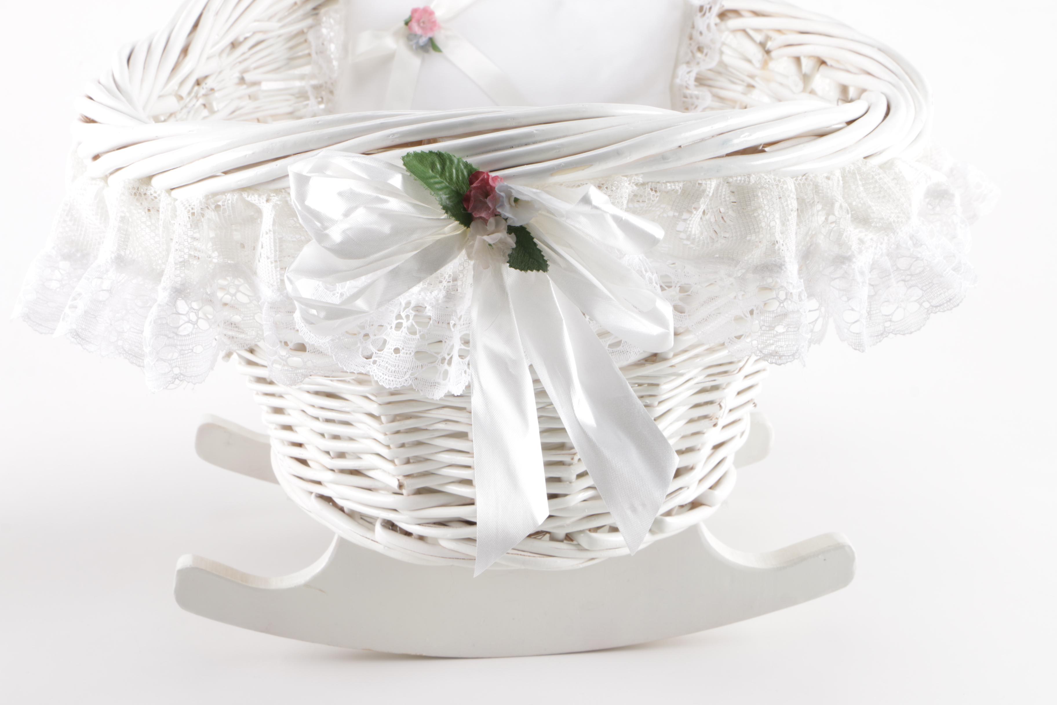 Porcelain Doll in Wicker Bassinet