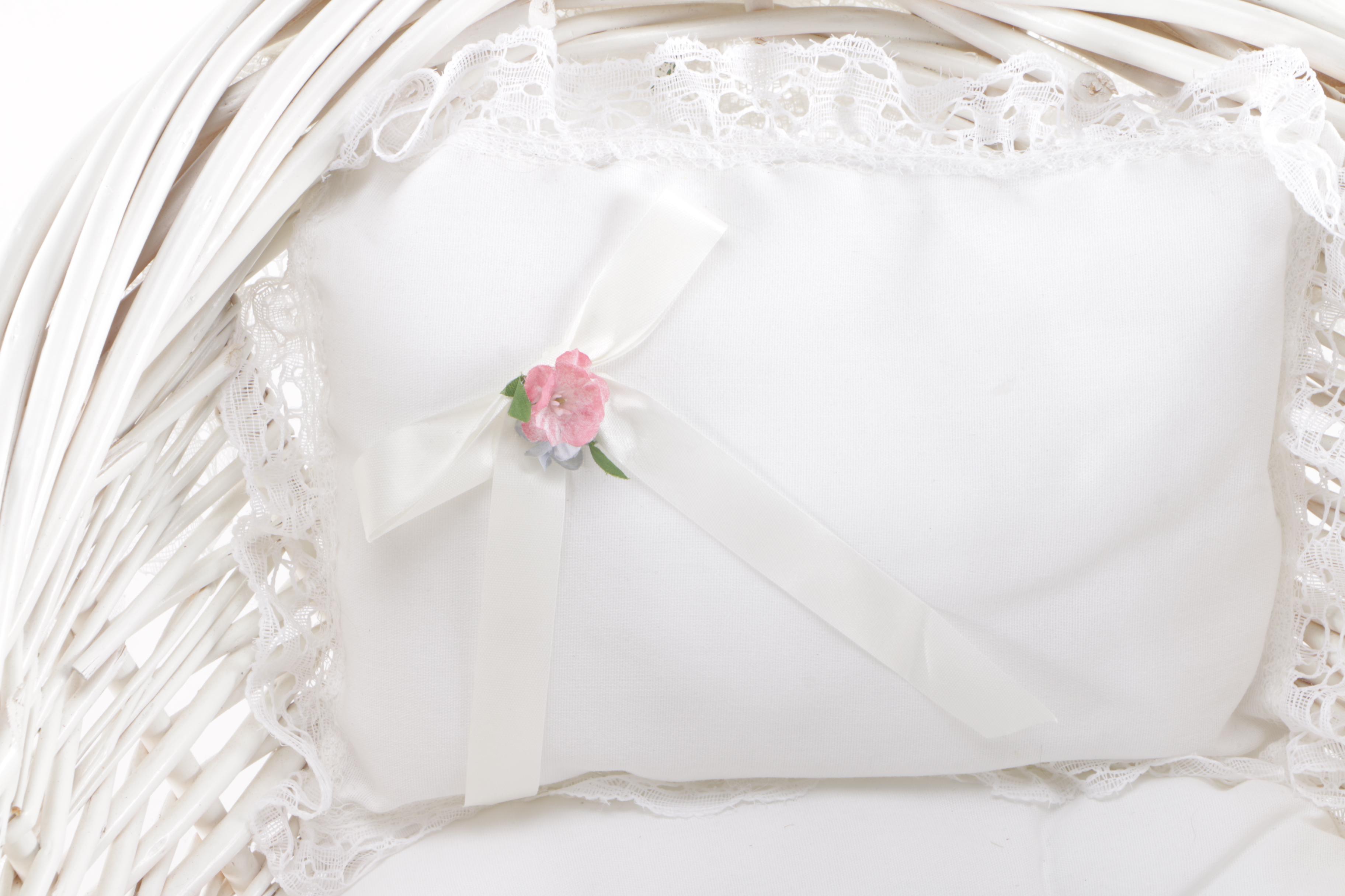 Porcelain Doll in Wicker Bassinet