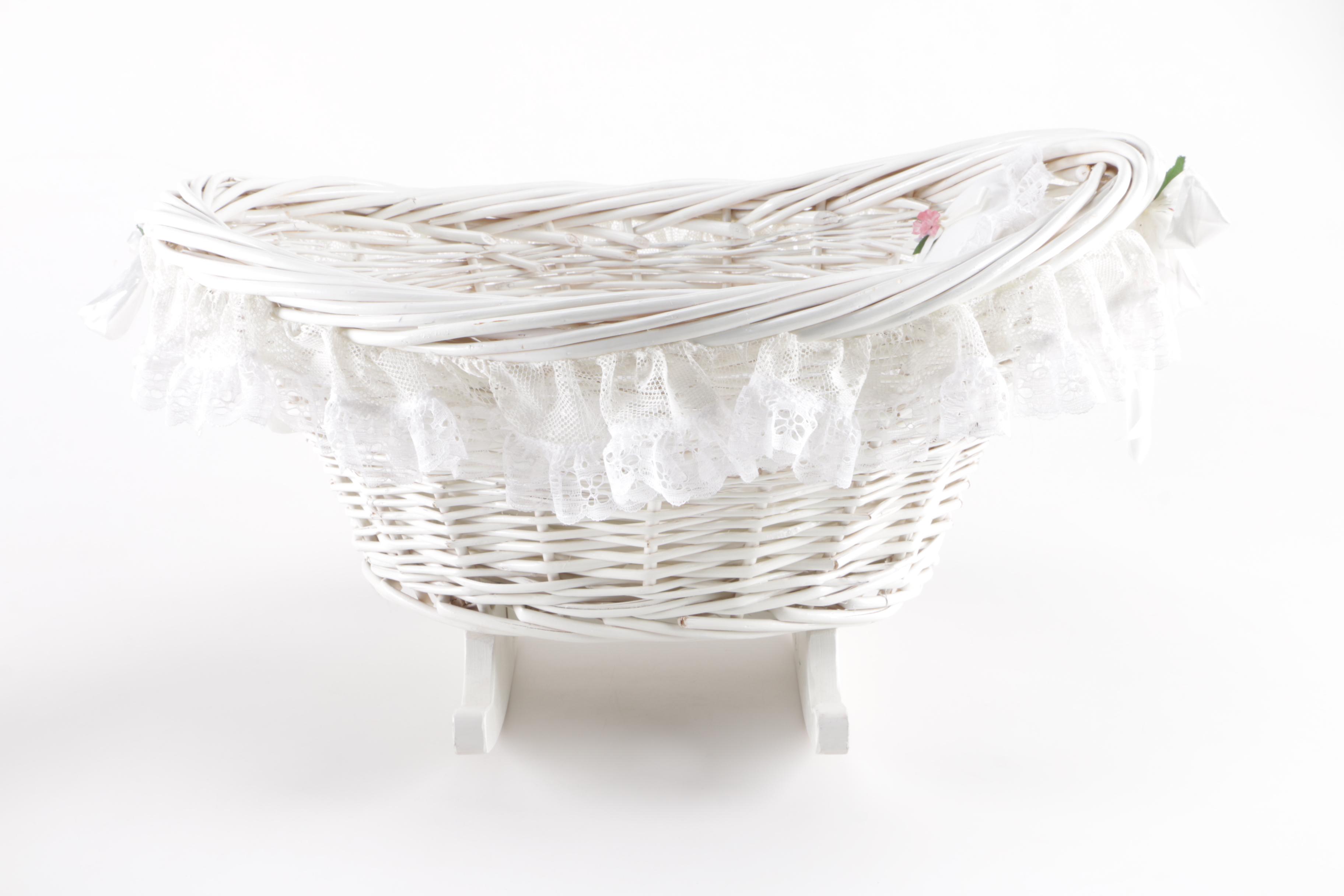 Porcelain Doll in Wicker Bassinet