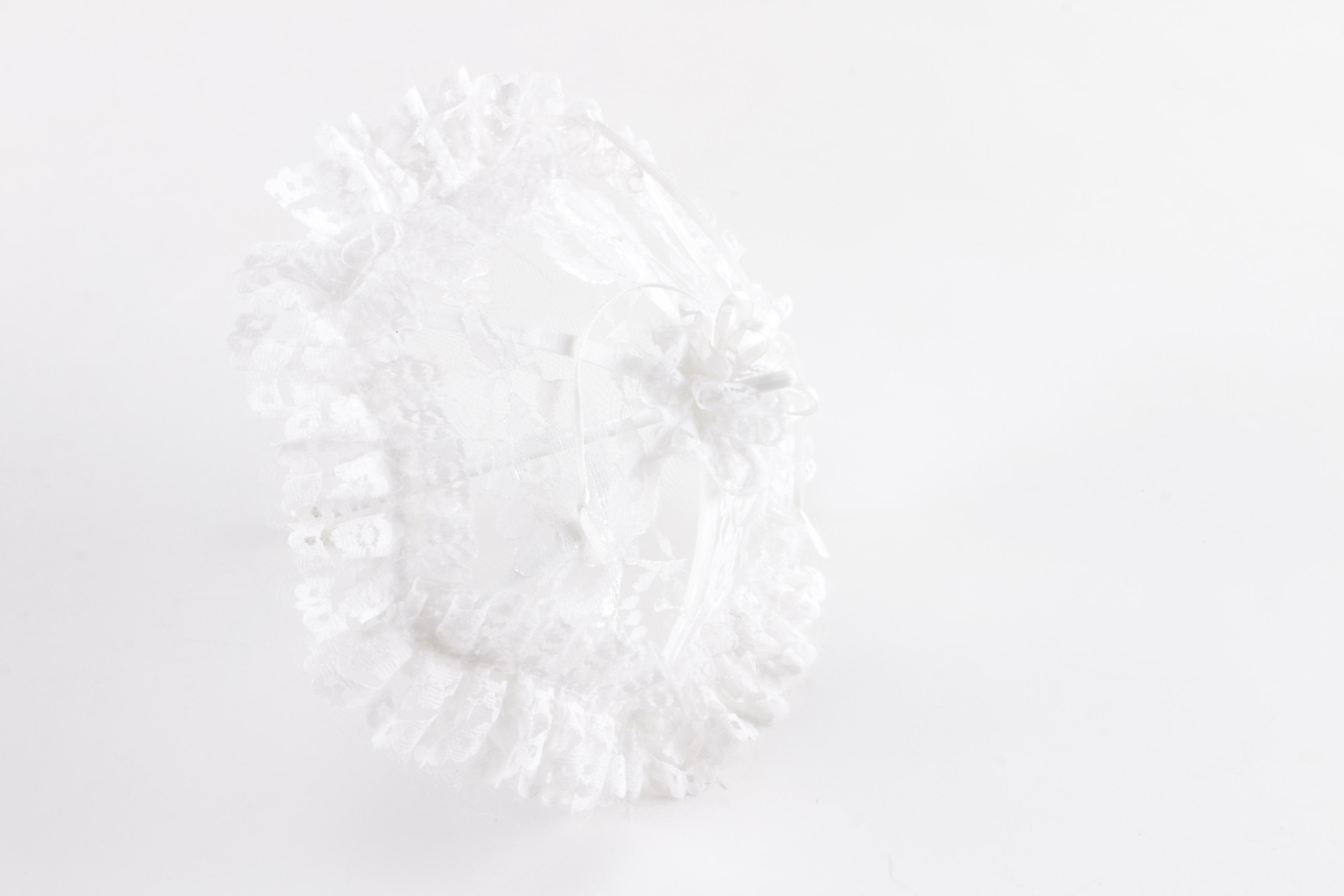 Porcelain Doll in Wicker Bassinet