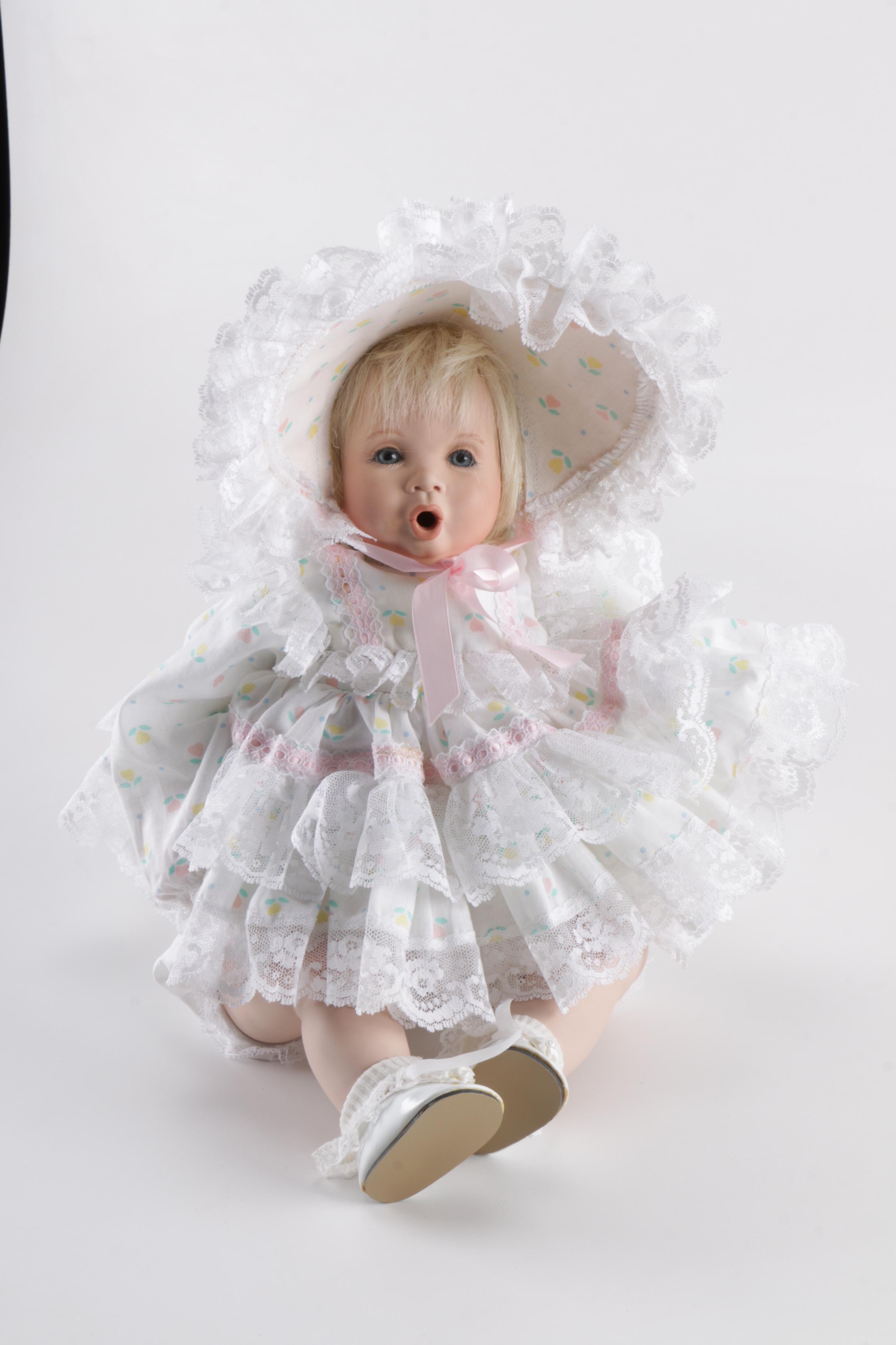 Porcelain Doll in Wicker Bassinet