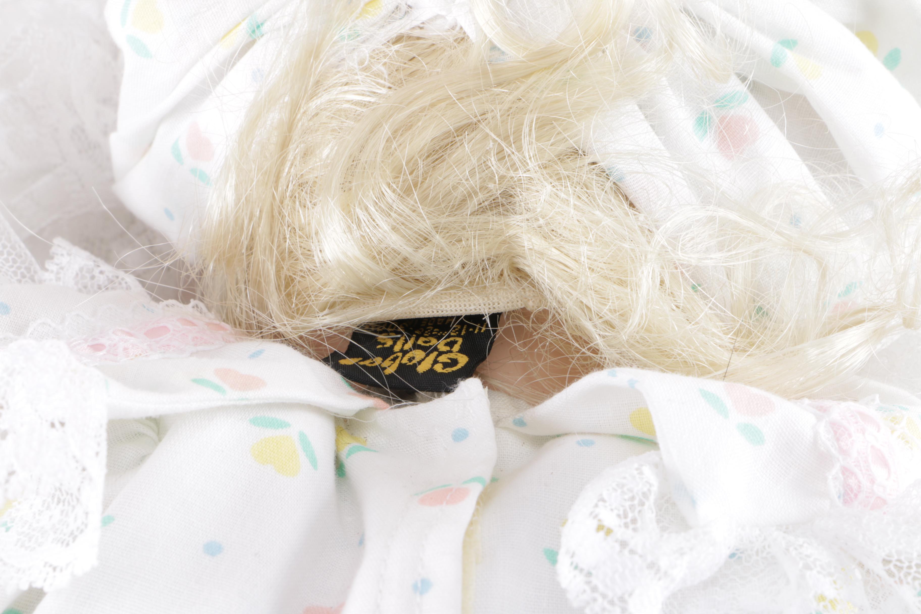 Porcelain Doll in Wicker Bassinet