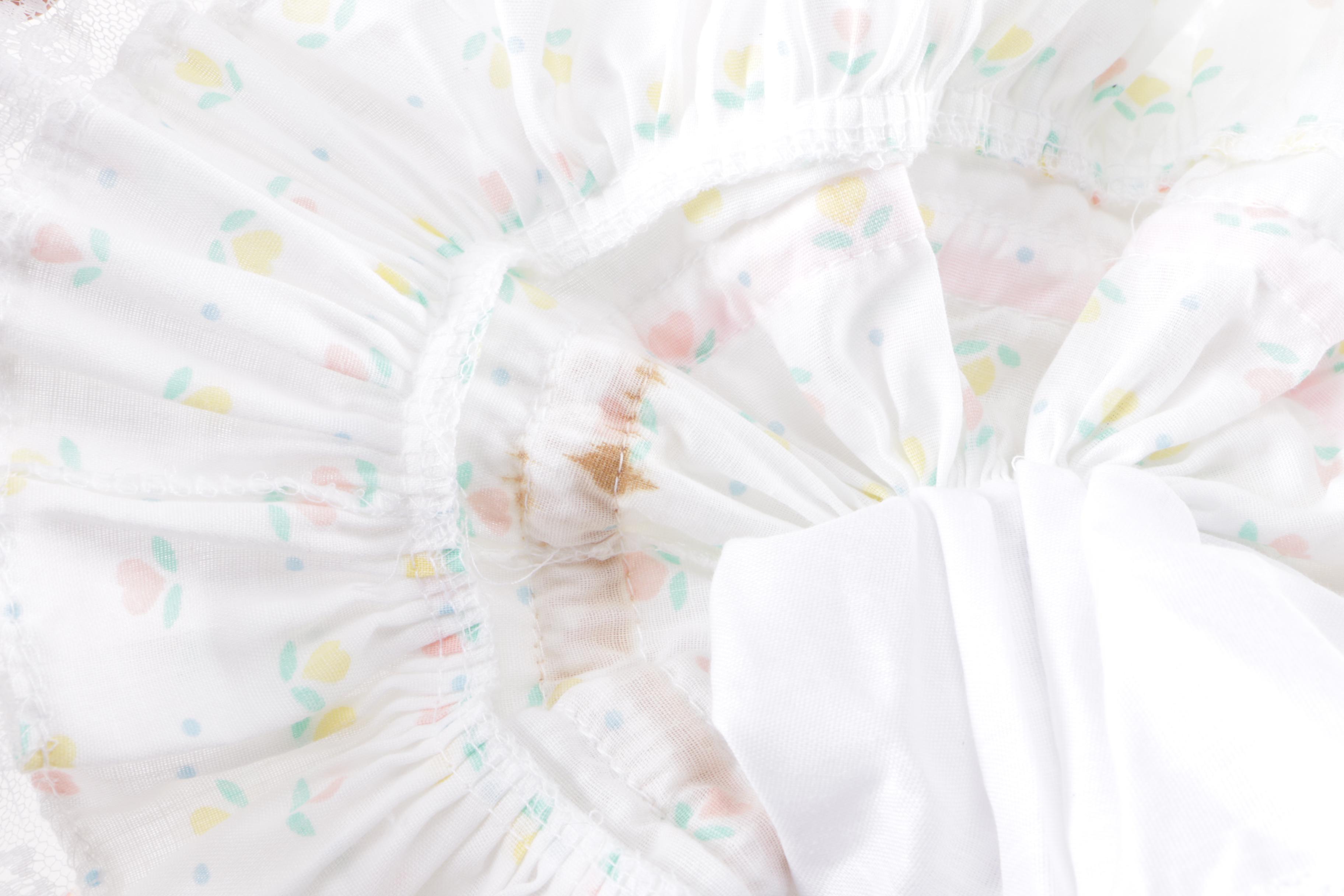 Porcelain Doll in Wicker Bassinet