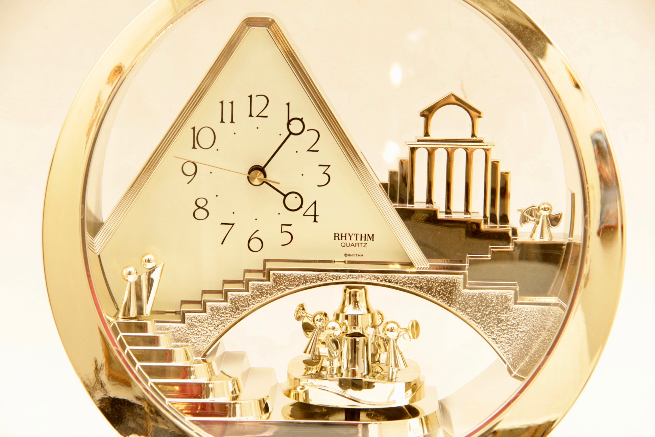 Circular Gold Toned Rhythm Quartz Clock