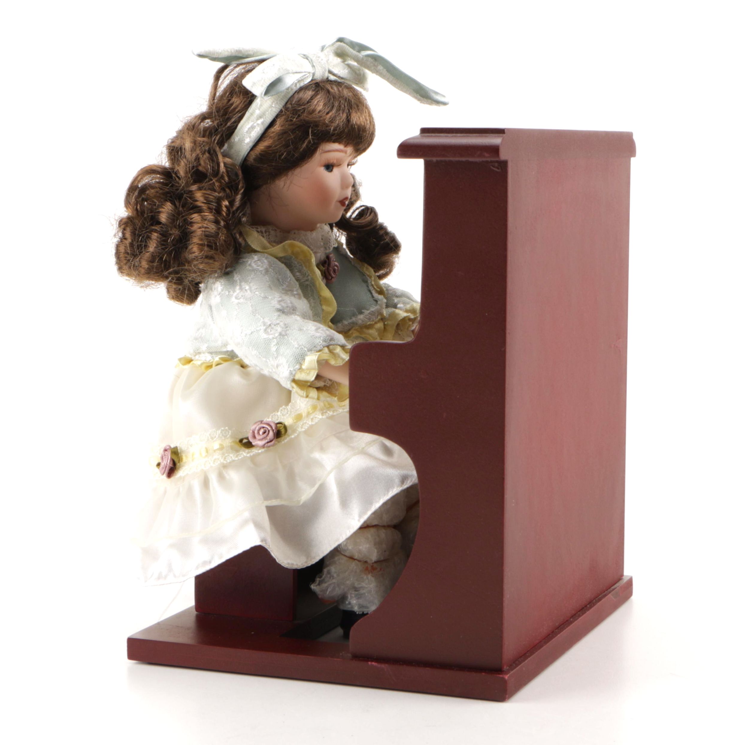 Porcelain Doll Playing Piano