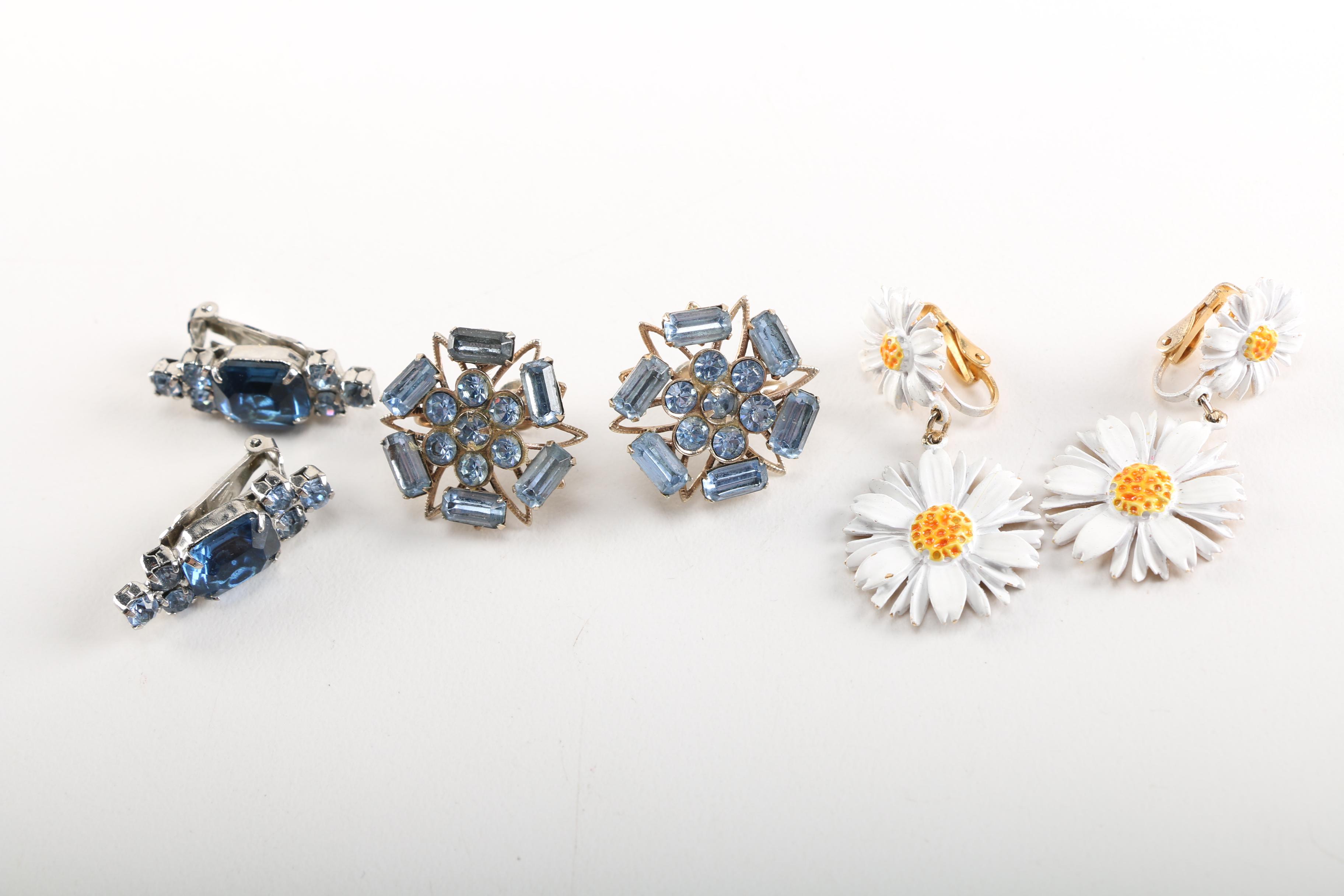 Assortment of Earrings Featuring a Pair Belt Buckles