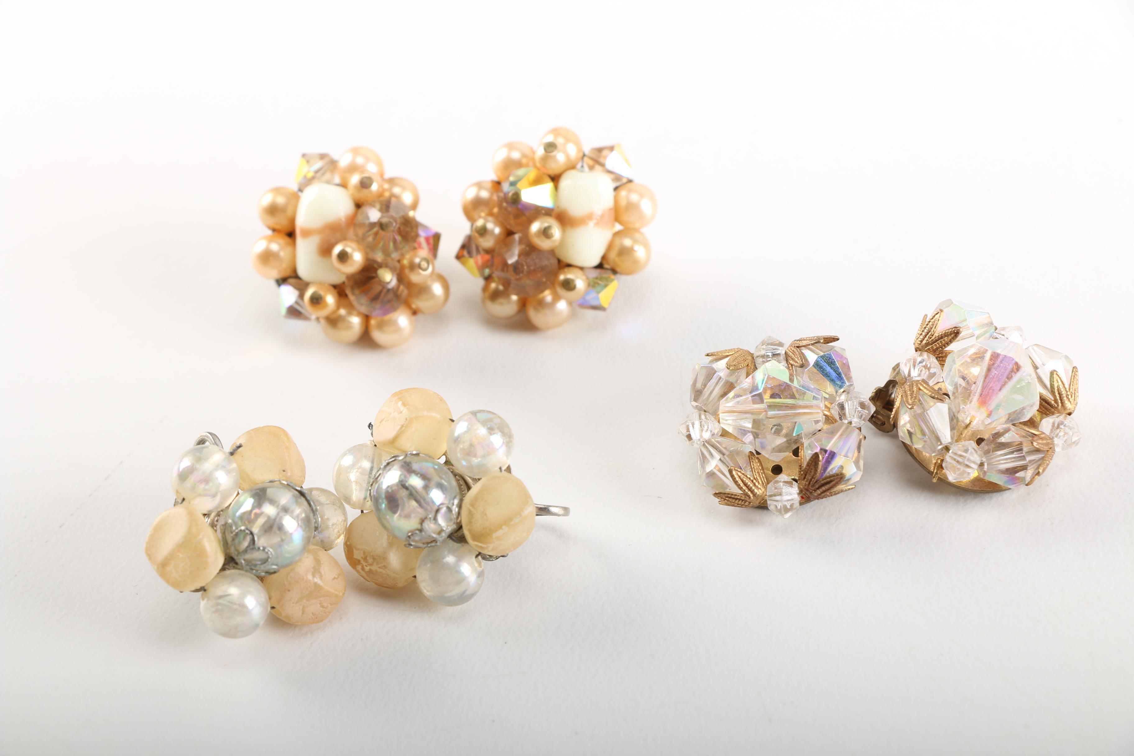 Assortment of Earrings Featuring a Pair Belt Buckles